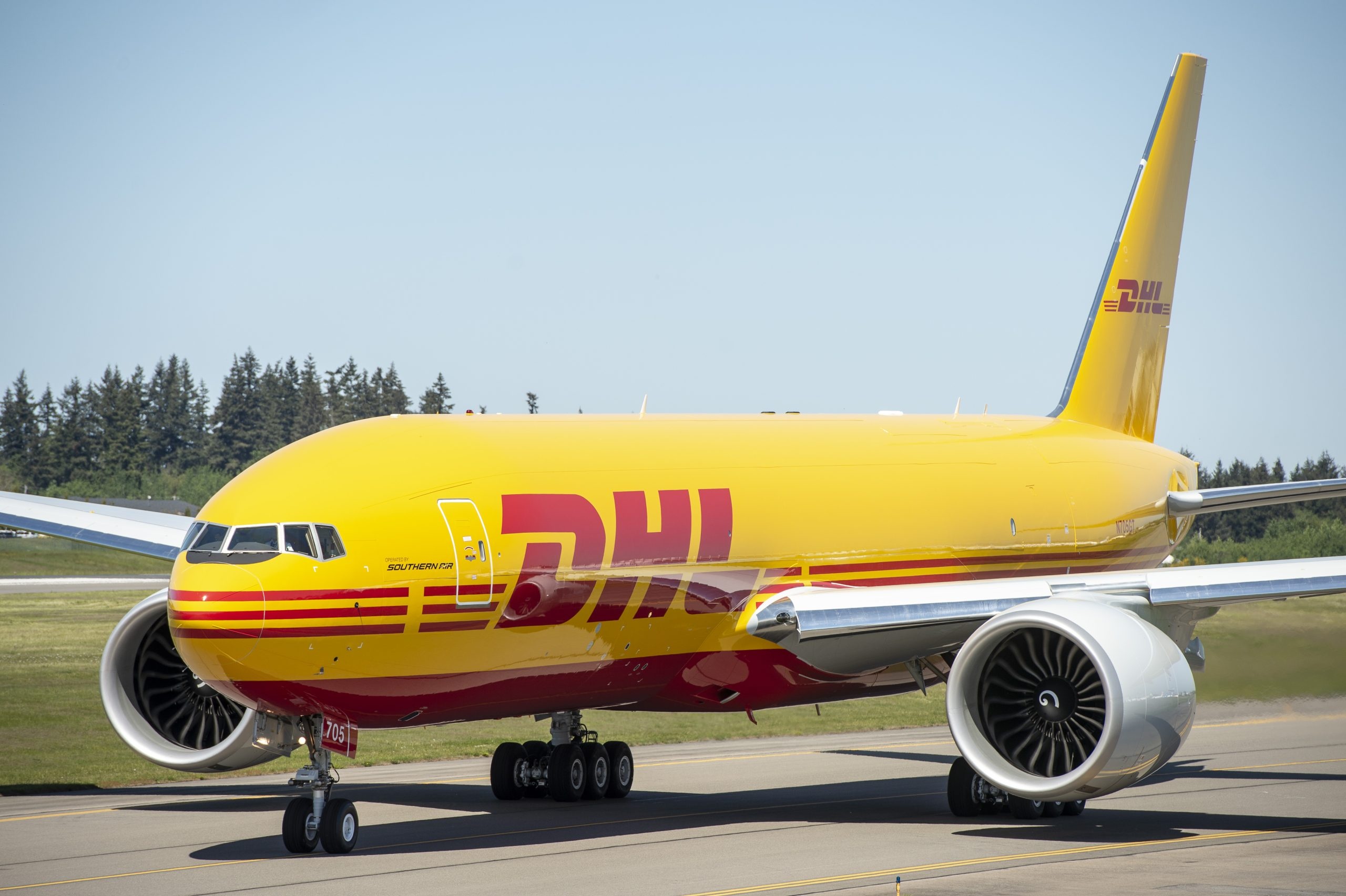 DHL: A comprehensive airport-to-airport service, Boeing 777. 2560x1710 HD Background.