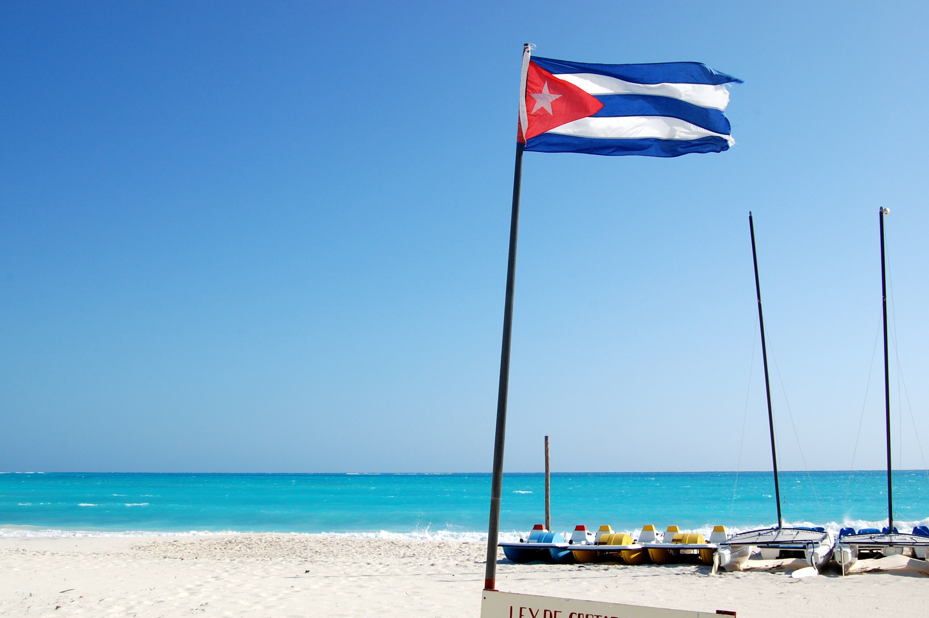 Cuba: Flag on the beach in the resort of Cayo Largo, The Caribbean. 3010x2000 HD Wallpaper.