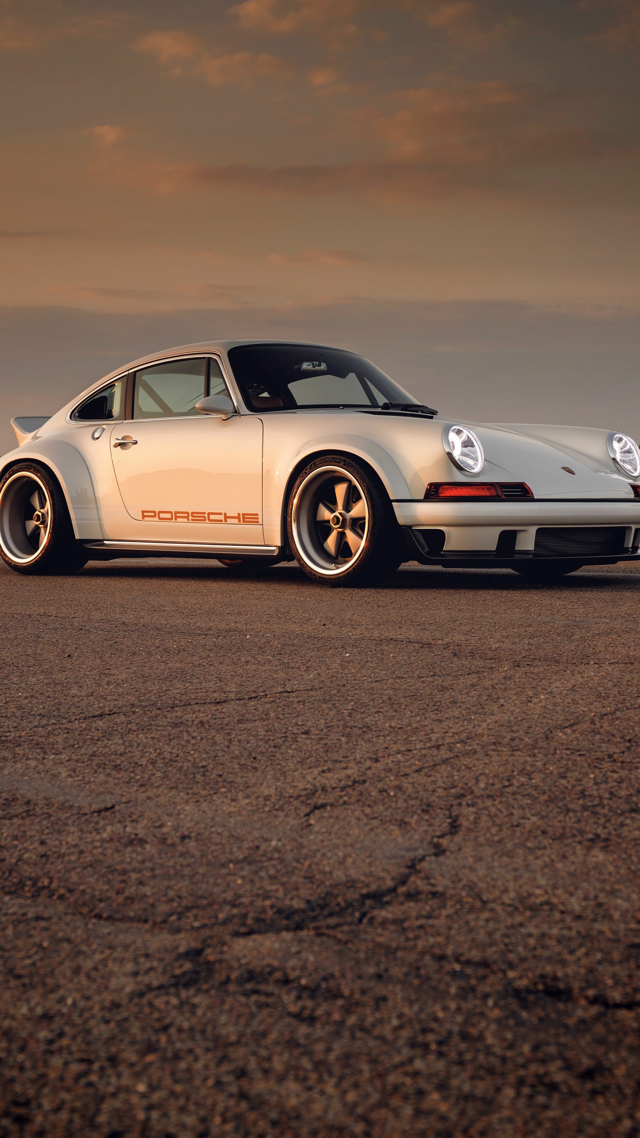 Porsche: The 964 is the company's internal name for the 911 manufactured and sold between 1989 and 1994. 2160x3840 4K Background.