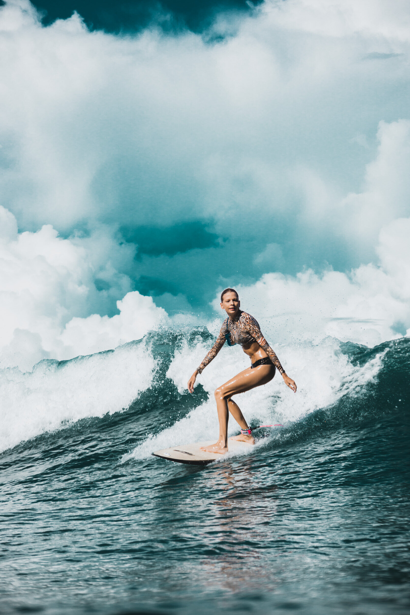 Girl Surfing: Orane Ragot riding on the face of a moving wave of water, Recreational outdoor activity. 1670x2500 HD Background.
