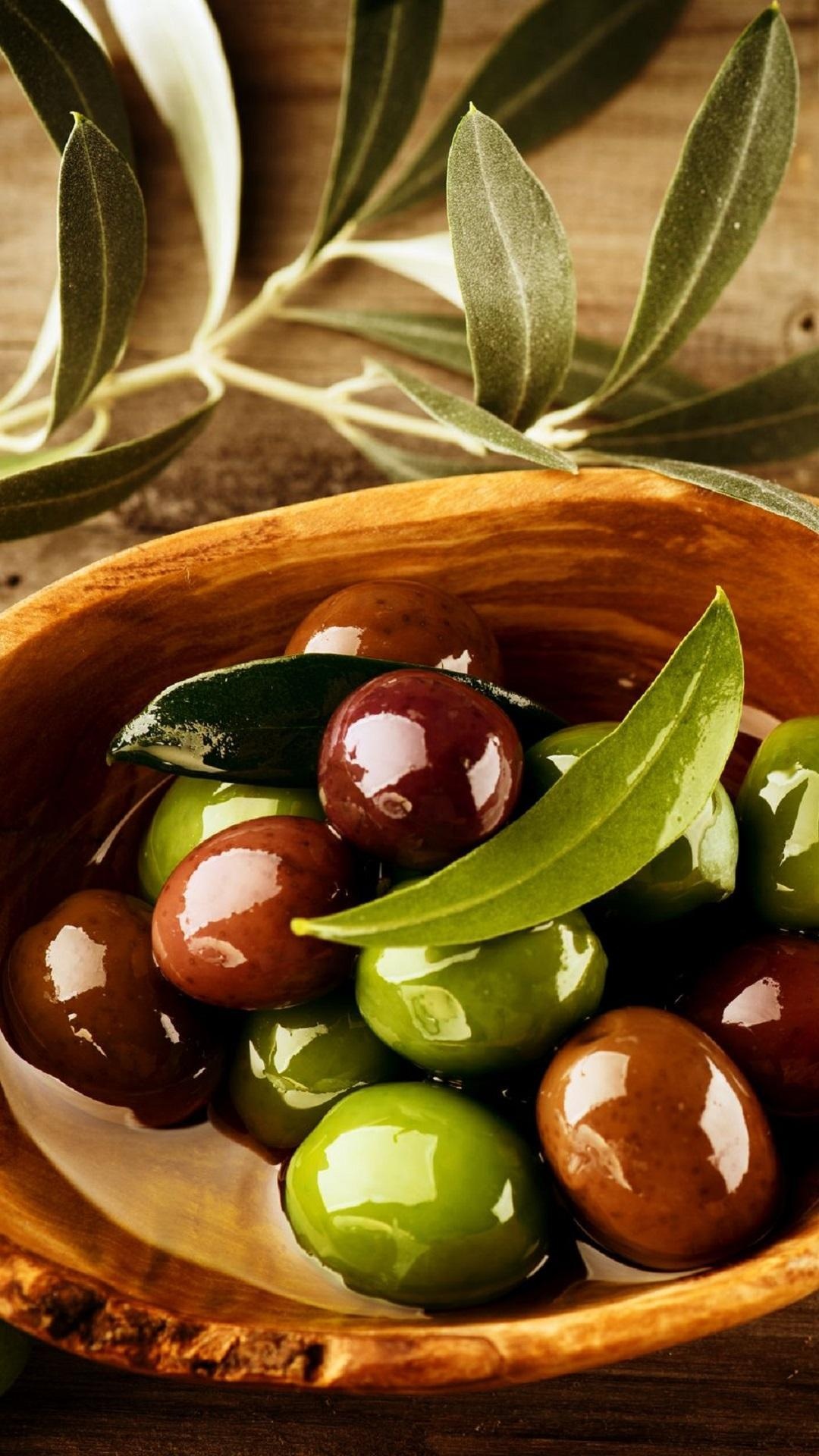 Olive: The fruit is a small drupe with a single seed inside, also known as a pit or stone. 1080x1920 Full HD Wallpaper.