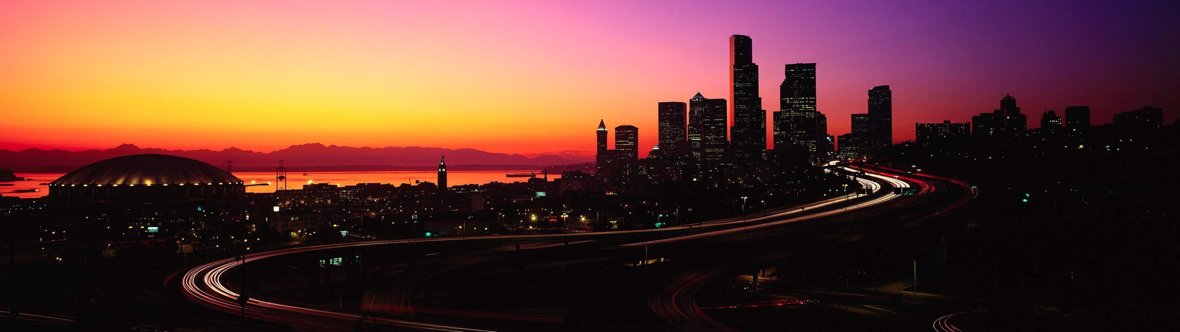 Skyline: The late dusk view of the stadium and the business district of Seattle, Washington State. 3840x1080 Dual Screen Background.