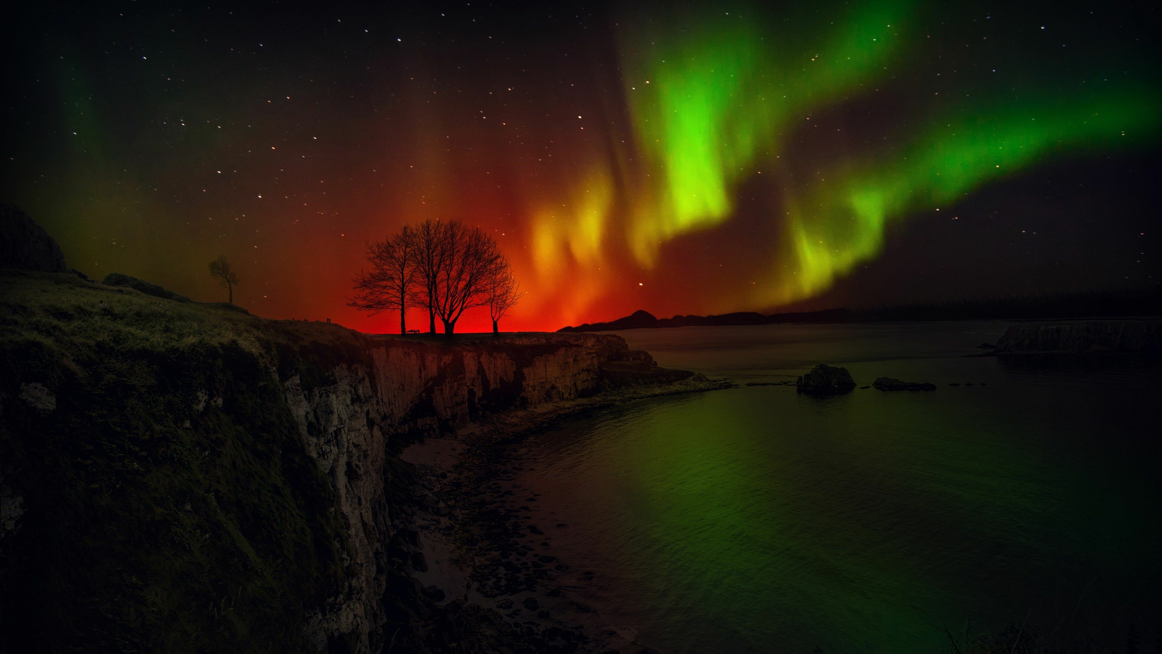Aurora Borealis: A natural light display in Earth's sky, can be seen near the poles of both the Northern and Southern Hemisphere. 3840x2160 4K Background.