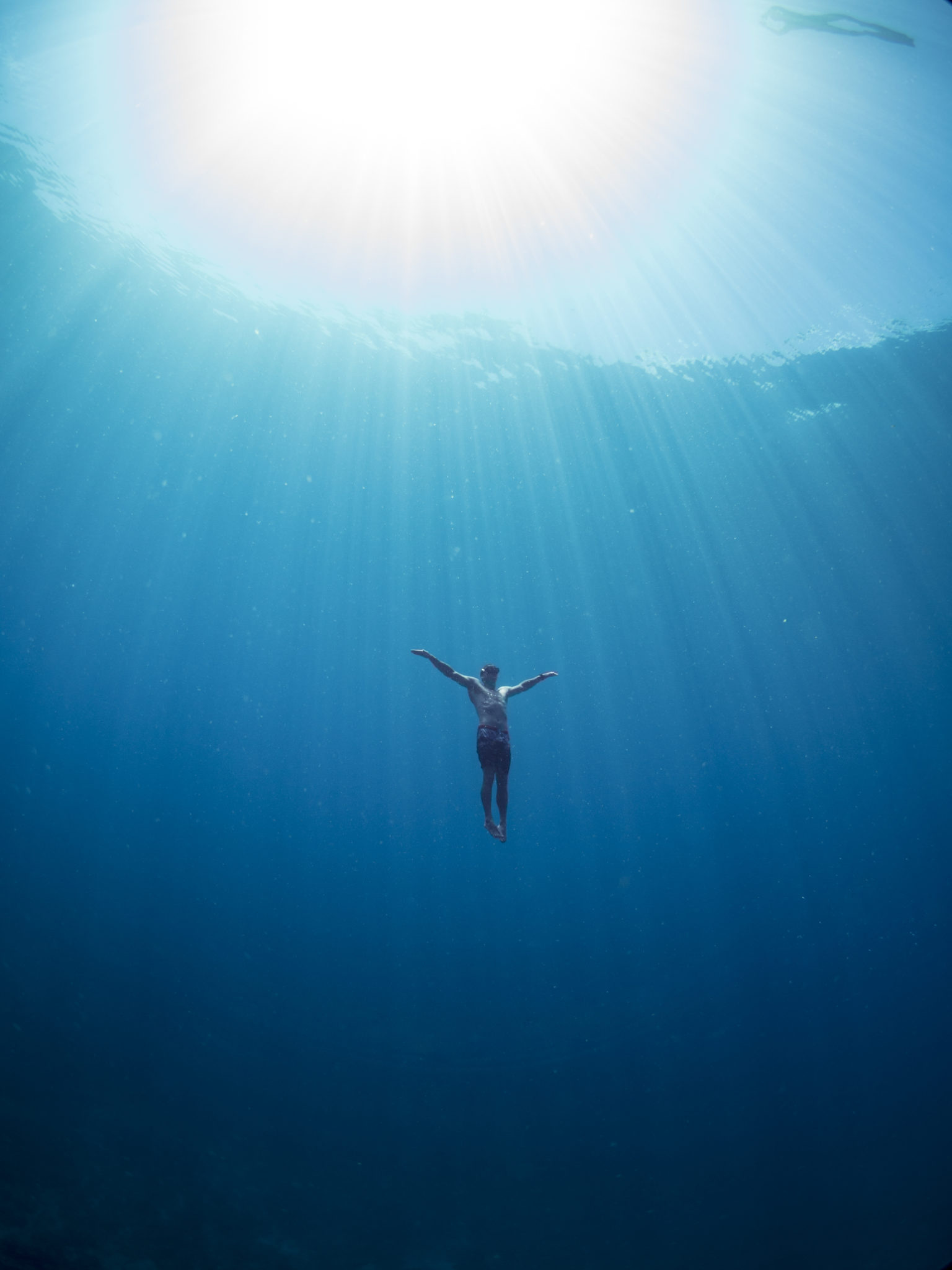 Freediving: A lonely skin diver, Recreational underwater activity and sport. 1540x2050 HD Wallpaper.