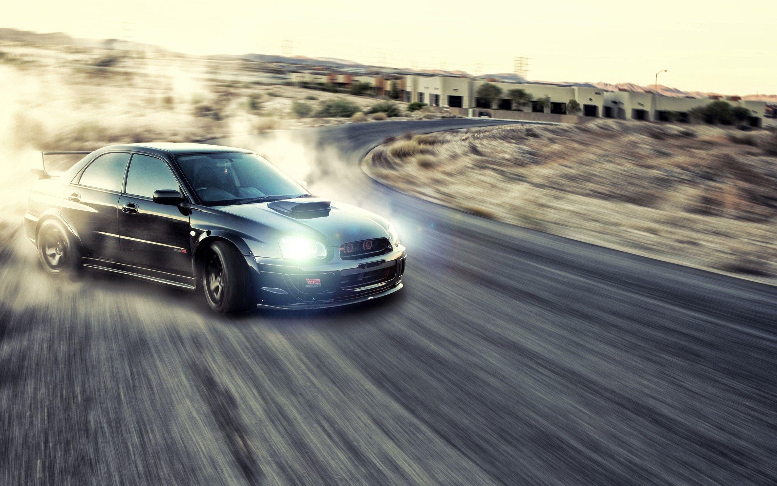 Drifting: Oversteered Subaru, Reap spoiler, Bonnet scoop, Racing sport. 2560x1600 HD Wallpaper.