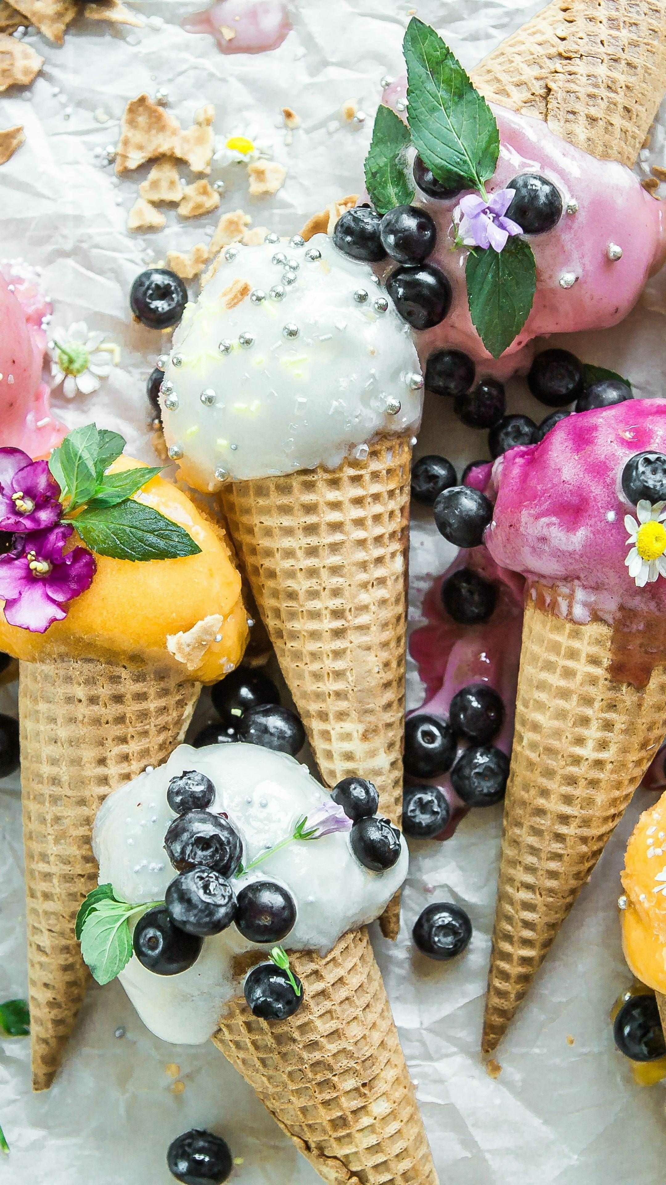 Ice Cream: Made from milk or cream and is flavored with a sweetener, either sugar or an alternative, and spice, such as cocoa or vanilla, or with fruit such as strawberries or peaches. 2160x3840 4K Background.