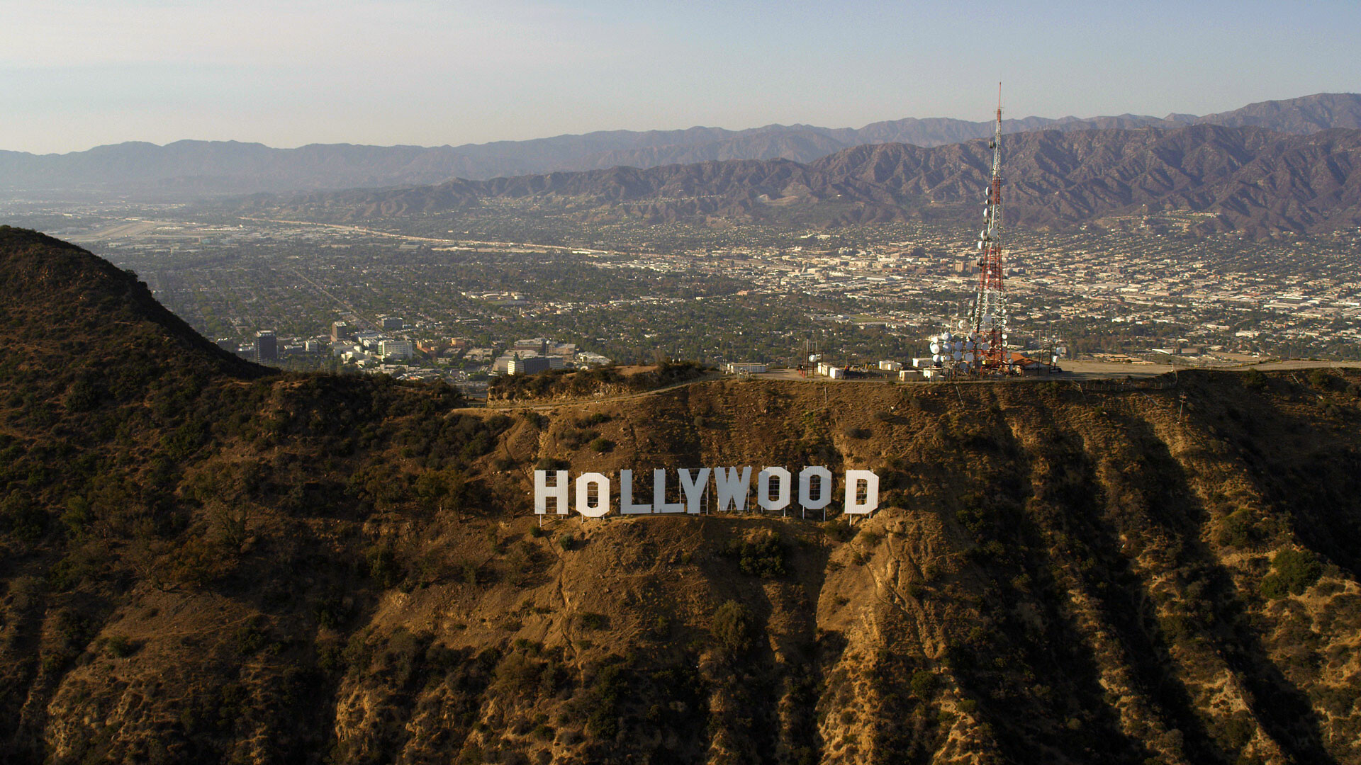 Hollywood Sign: An American landmark, overlooking Los Angeles, California. 1920x1080 Full HD Background.