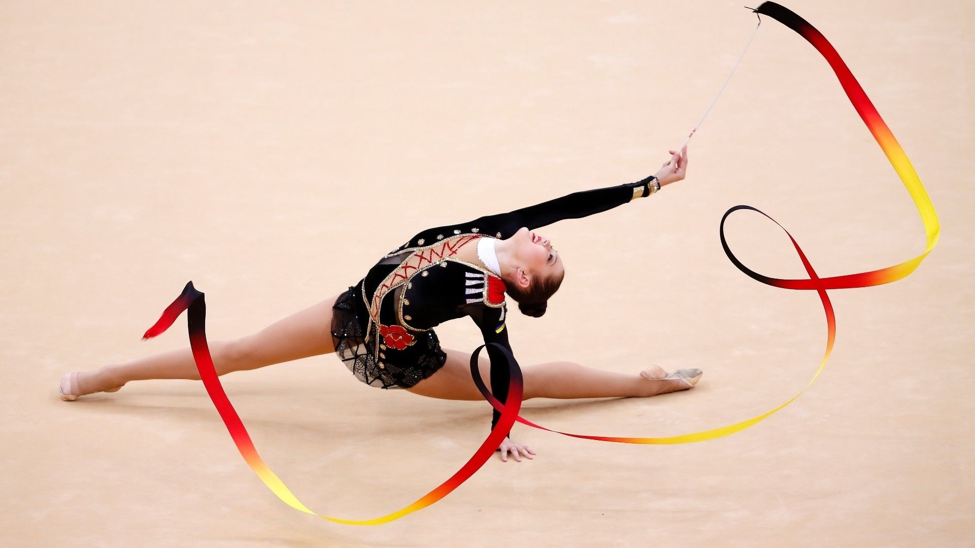 Rhythmic Gymnastics: A professional sports choreography performance by a young gymnast with a ribbon. 1920x1080 Full HD Background.