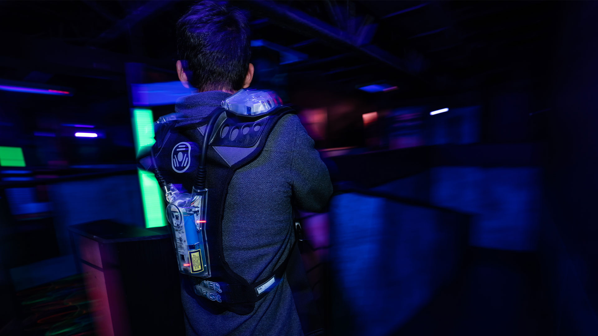 Laser Tag: A shooter equipped with a special vest with infrared sensor and LED lights, Light guns sports equipment. 1920x1080 Full HD Background.