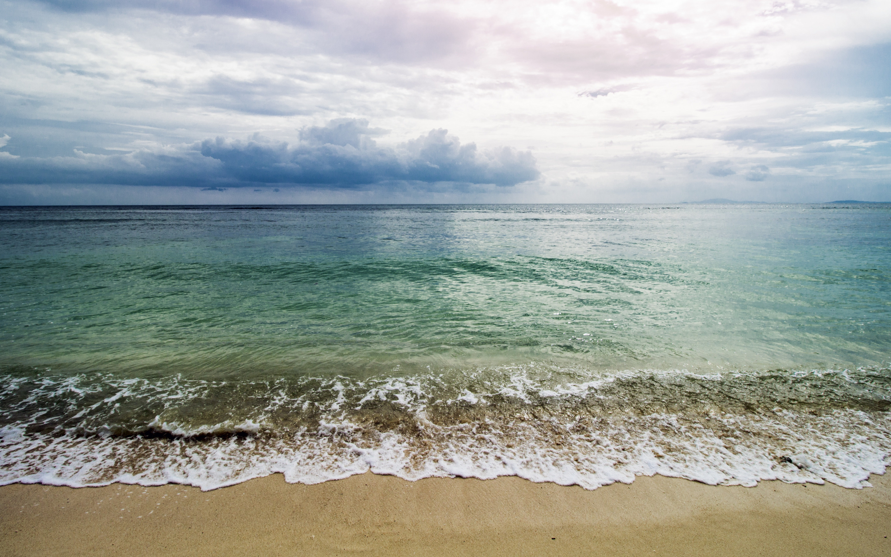 Seascape: Sandy coast of the sea, Sea breeze, Foamy but still waves, A place for vacation. 2880x1800 HD Background.
