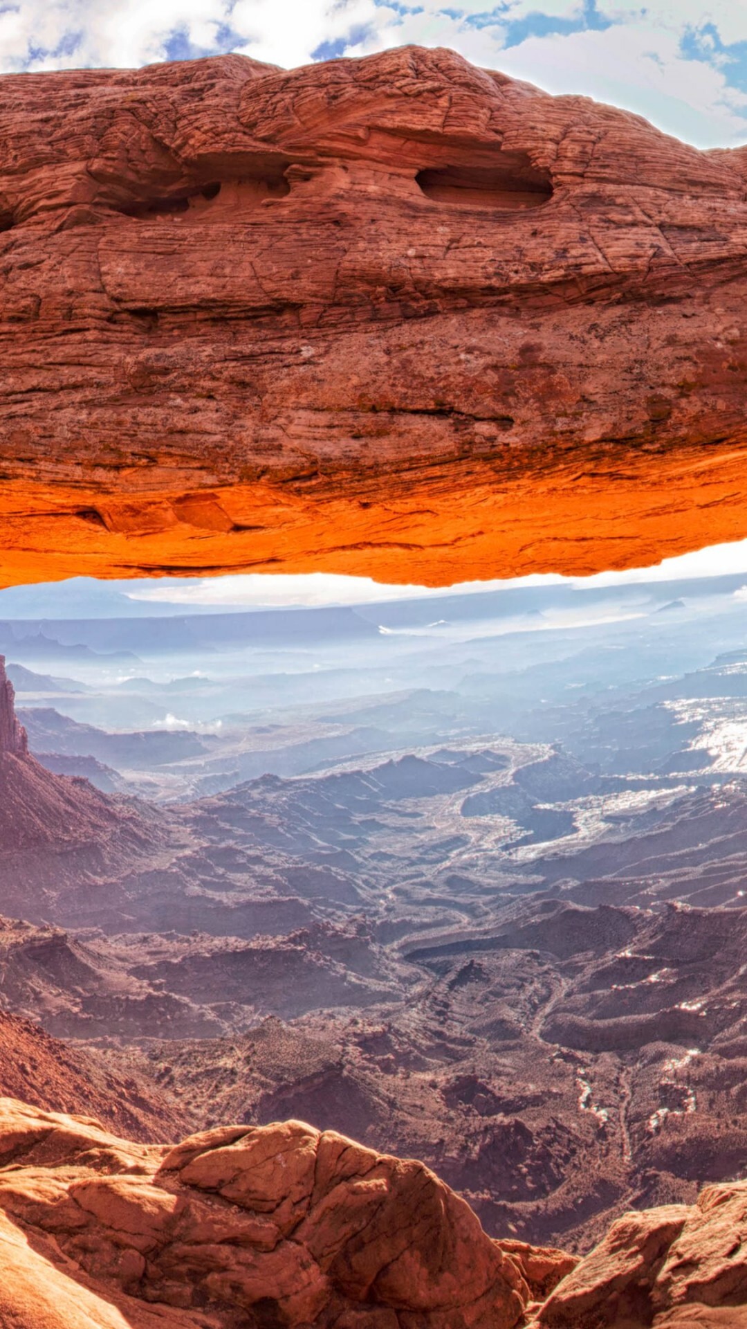 Geology: Mesa Arch, Canyon lands, Utah, USA, Places for ravel, A hilly area has a lot of hills. 1080x1920 Full HD Wallpaper.