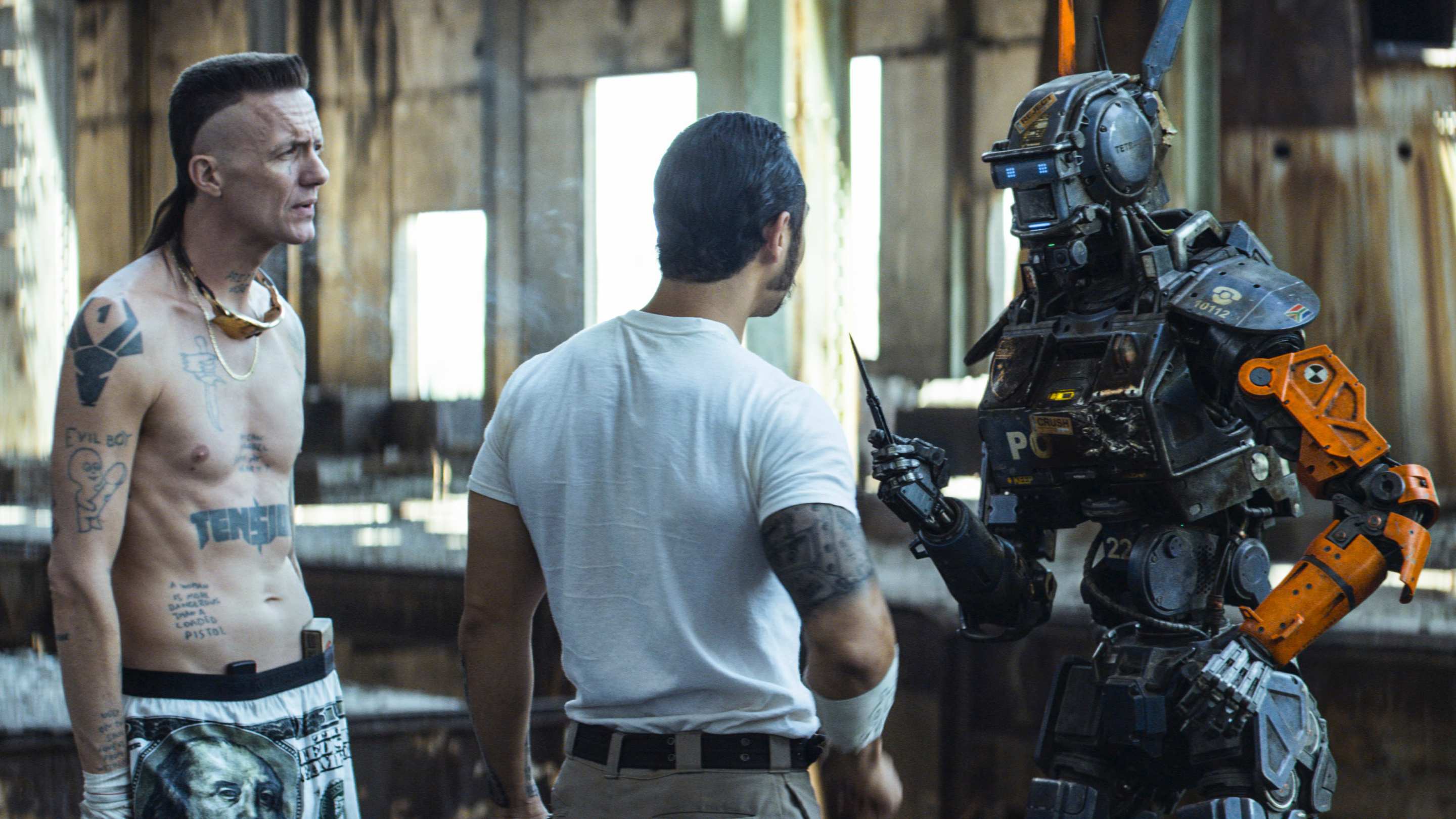 Chappie: The first robot with the ability to think and feel for himself. 2880x1620 HD Background.