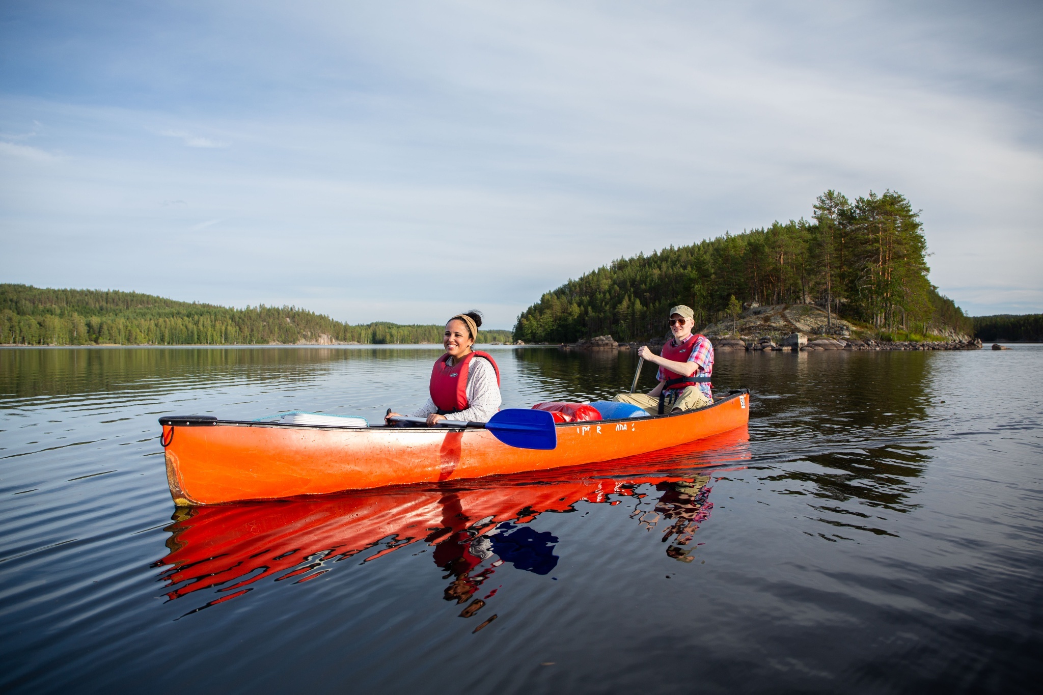 Canoeing: A couple moves over the river at the Linnansaari National Park kayaking trail. 2050x1370 HD Background.