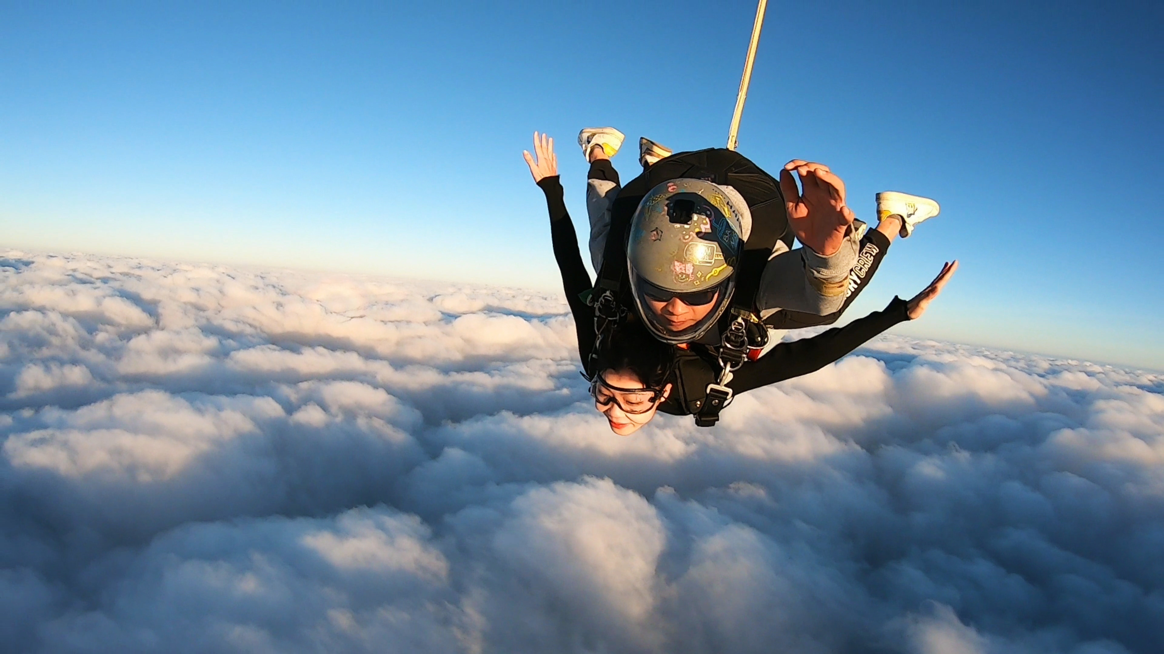 Parachuting: Skydiving, Tandem jumping and extreme sports in Yangjiang, China. 3840x2160 4K Background.