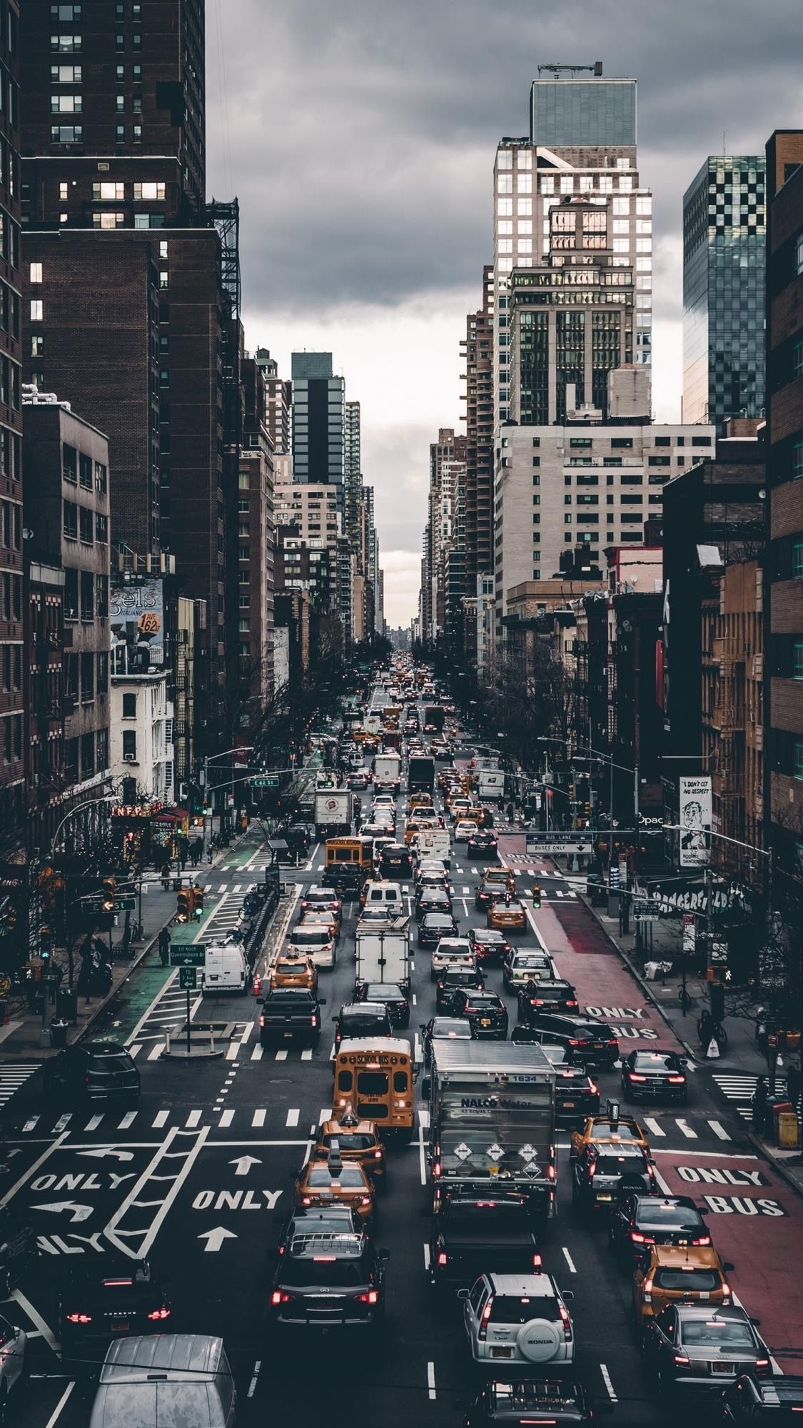 City: Traffic in New York, Yellow NY Taxi, Schools buses, 2nd Avenue, Manhattan. 1130x2000 HD Background.