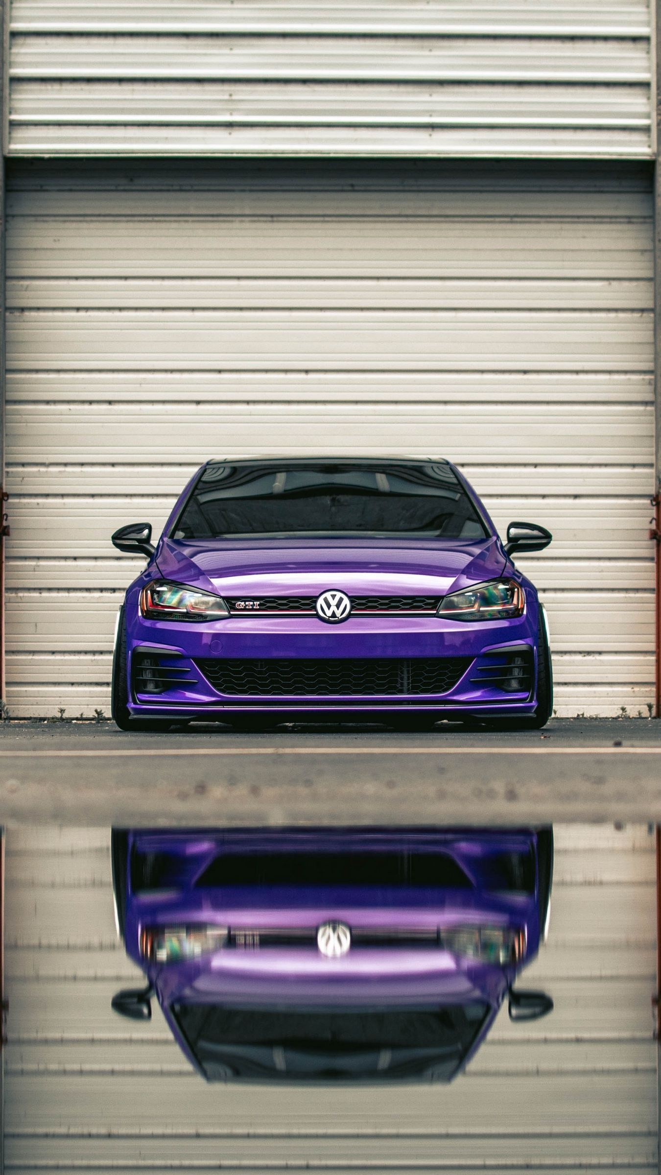 Golf GTI: Purple car, The sports version of the iconic German Volkswagen car of the “compact” class. 1350x2400 HD Background.
