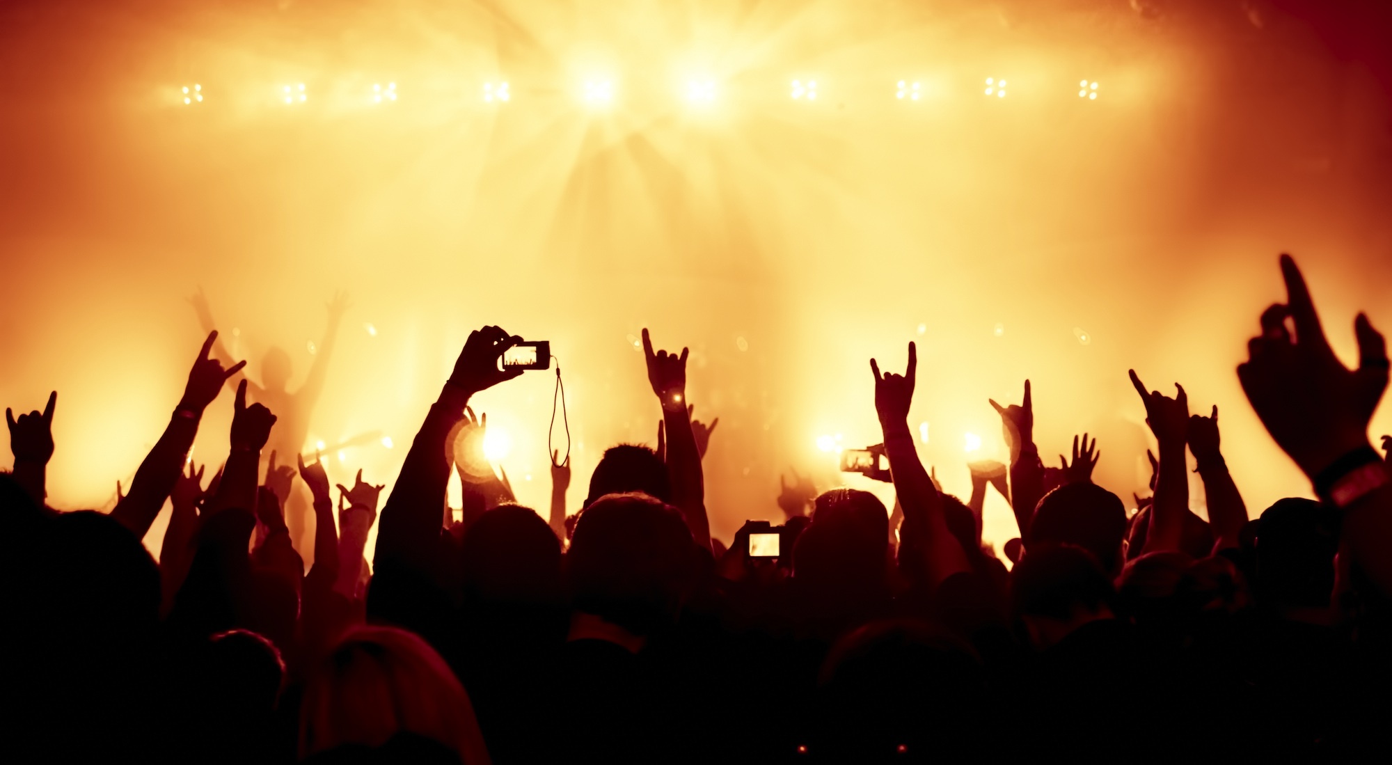 Concert: Light effects at the stage, A world-famous superstar, Crowded music hall. 2000x1100 HD Wallpaper.