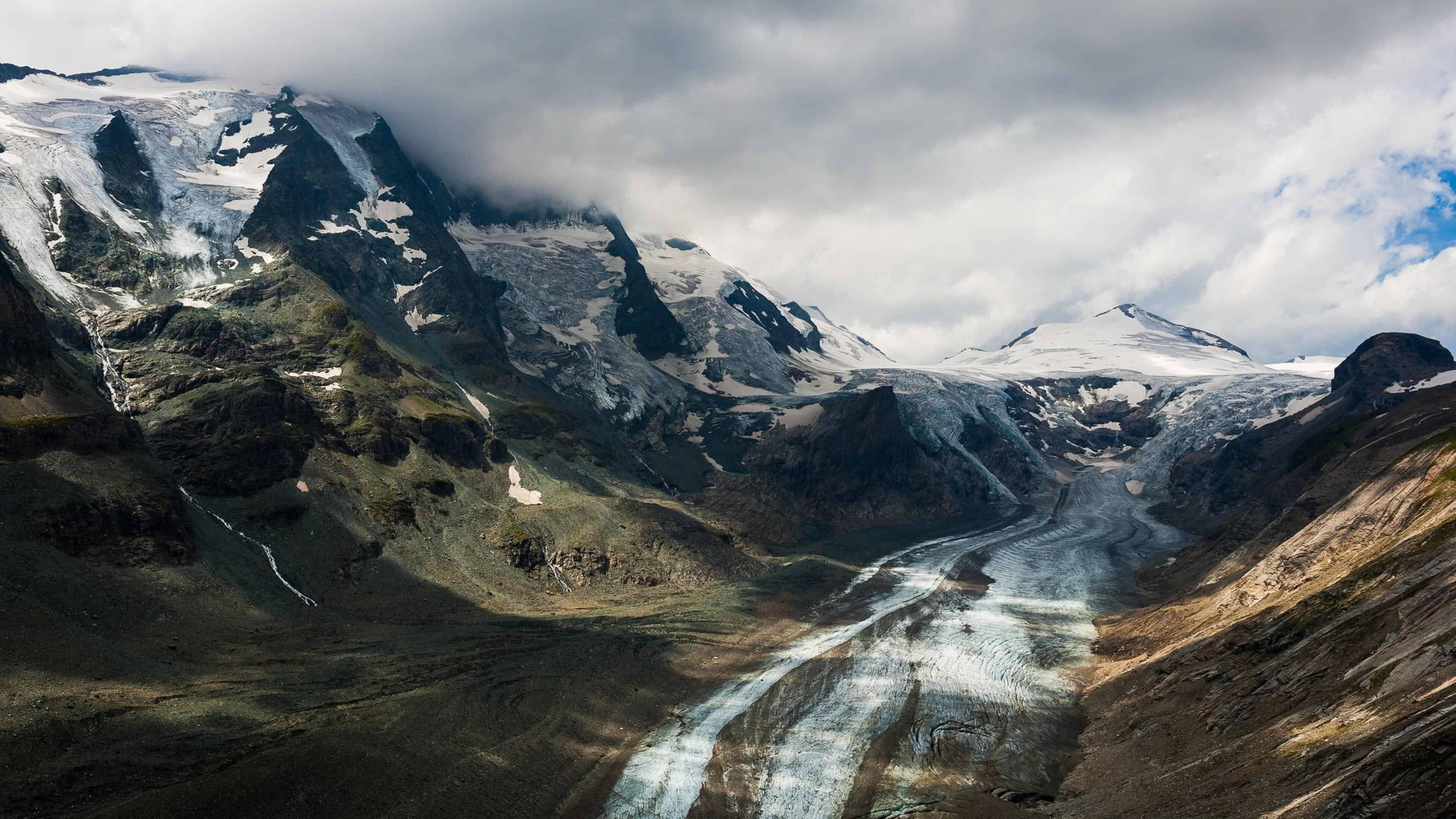 Glacier: Pasterze Glacier, Austria, Massive body of slowly moving ice, Frozen water. 3840x2160 4K Background.