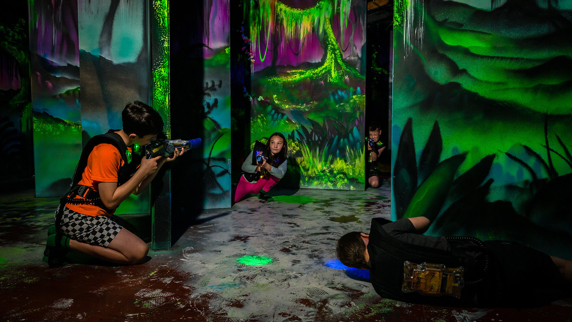 Laser Tag: Teams compete while shooting each other with light guns, A family leisure. 1980x1120 HD Background.