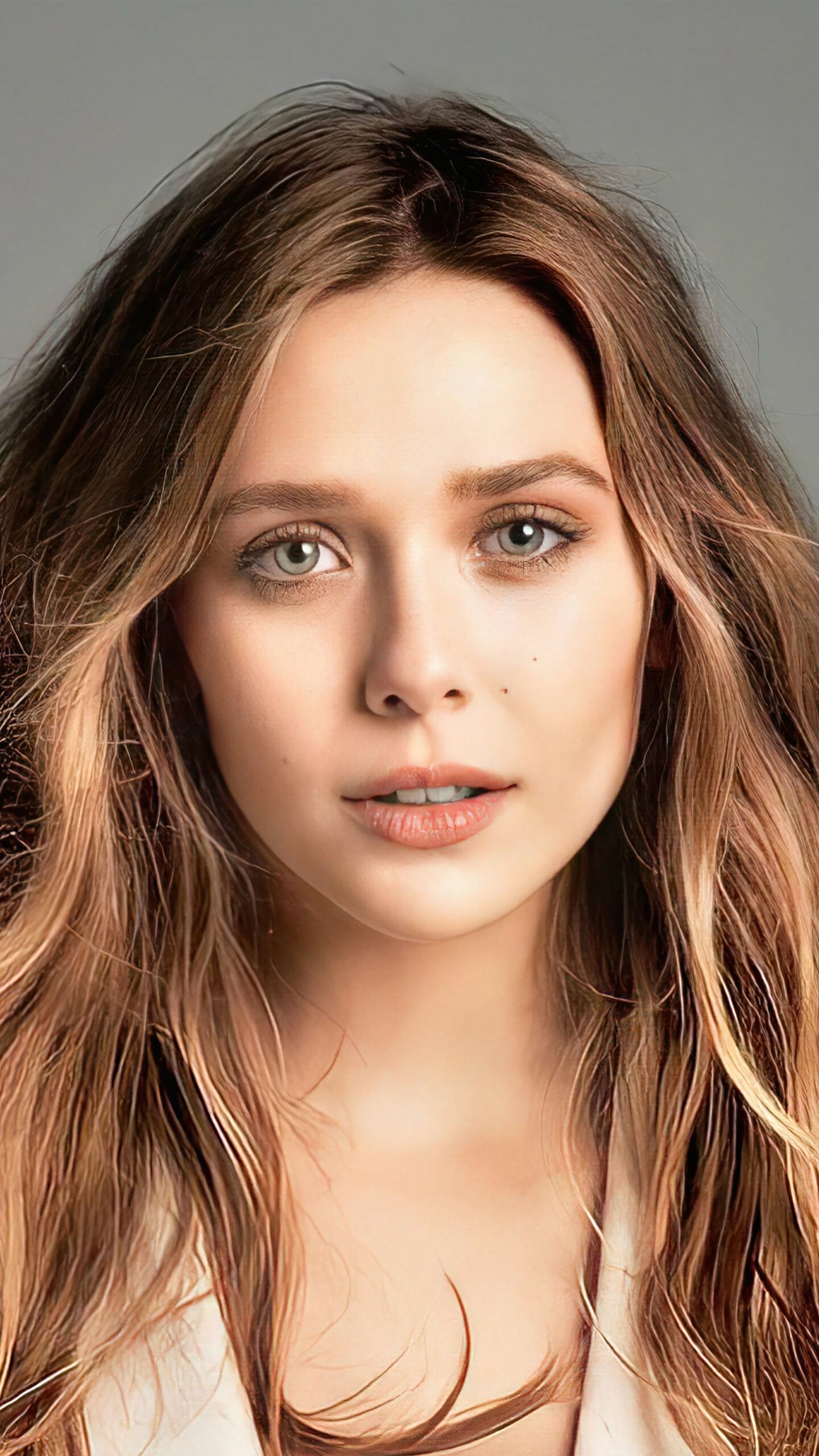 Elizabeth Olsen: Better known to audiences as the Scarlet Witch, The Marvel Cinematic Universe media franchise. 1440x2560 HD Background.