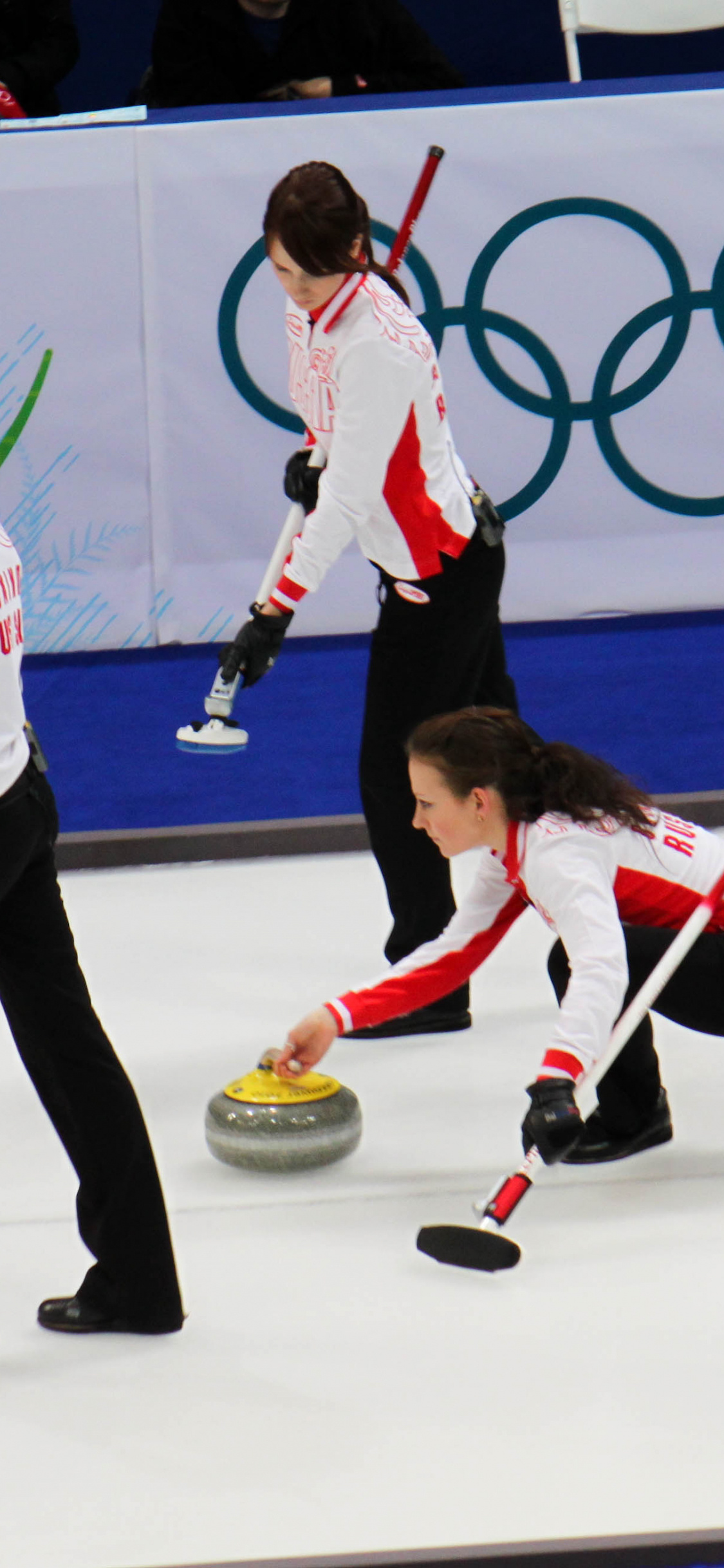 Curling: Margarita Fomina, Anna Sidorova, Ekaterina Galkina, The 2010 Winter Olympics. 1130x2440 HD Background.