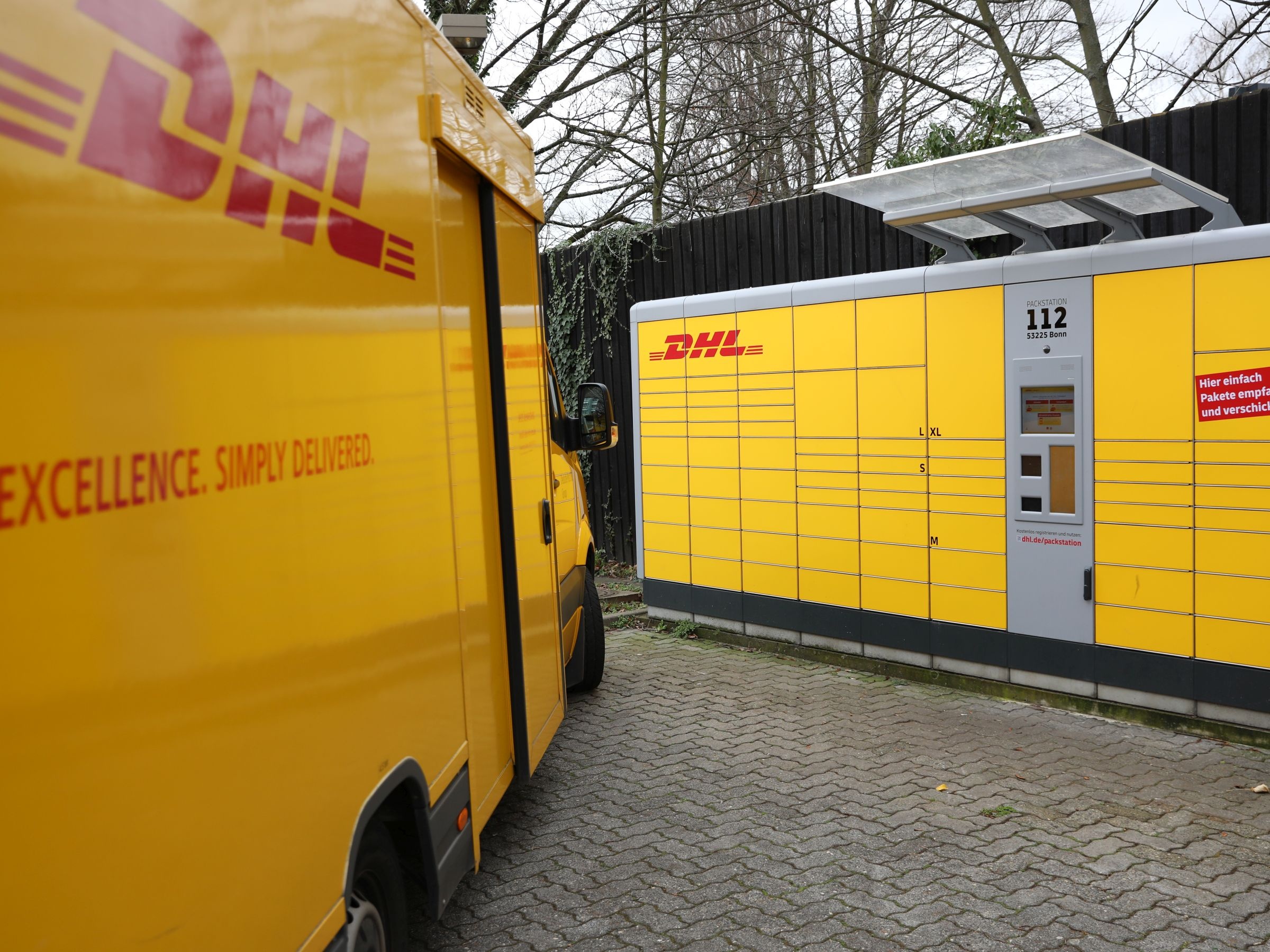 DHL: Smart outdoor parcel lockers, World's leading logistics company. 2400x1800 HD Background.