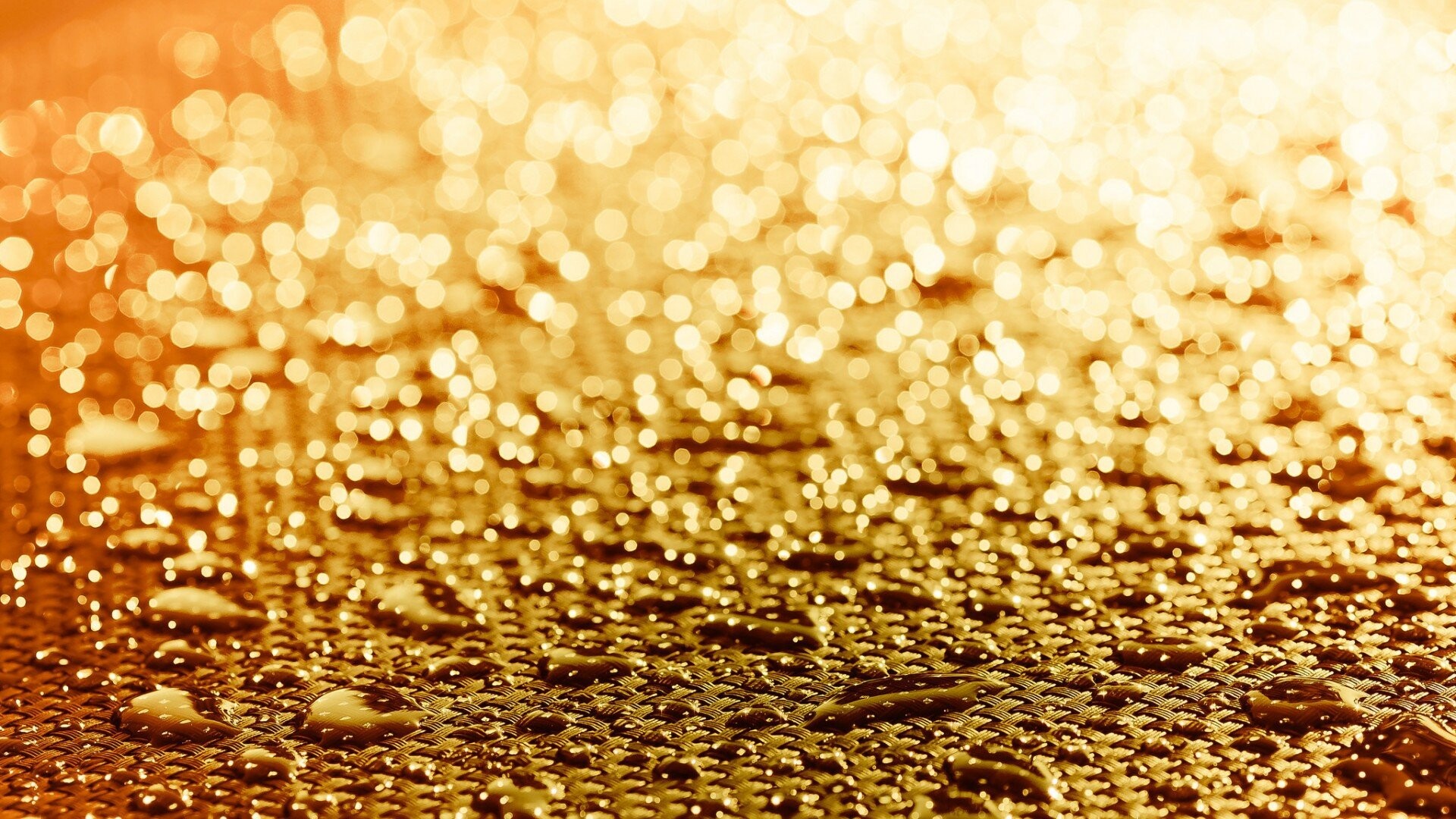 Gold Lights: Blurred lights on the wet surface, Rain drops on the braided fabric. 1920x1080 Full HD Background.