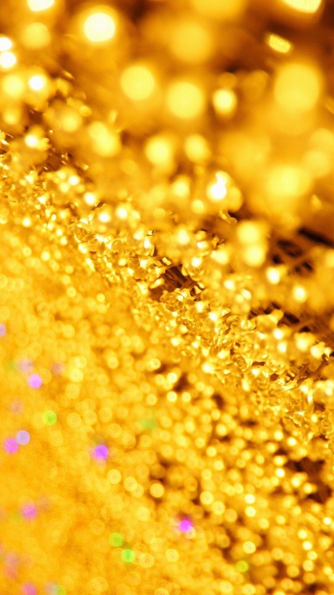 Gold Sparkle: Glitter gold, Shining material consisting of an assortment of small, reflective particles. 1080x1920 Full HD Background.
