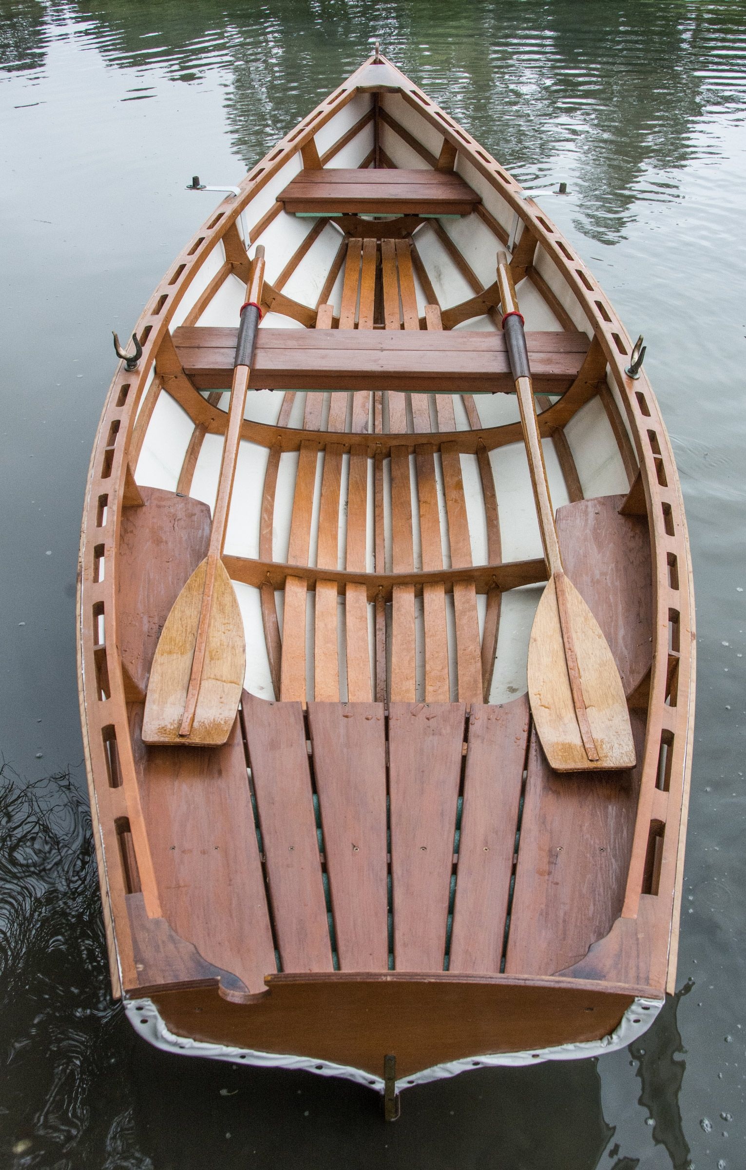 Rowing: A classic boat made of wood with two paddles, Equipment for recreational boating. 1540x2400 HD Wallpaper.