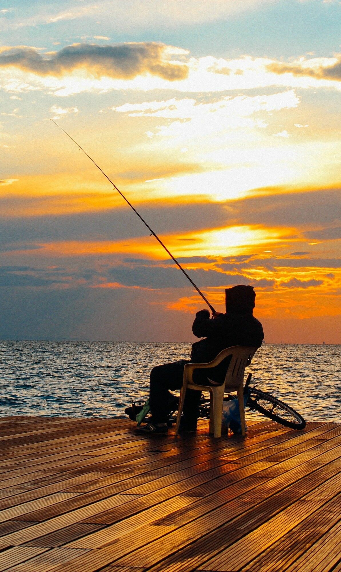 Fishing sunset, Vivid colors, Breathtaking scenery, Nature's beauty, 1200x2000 HD Phone