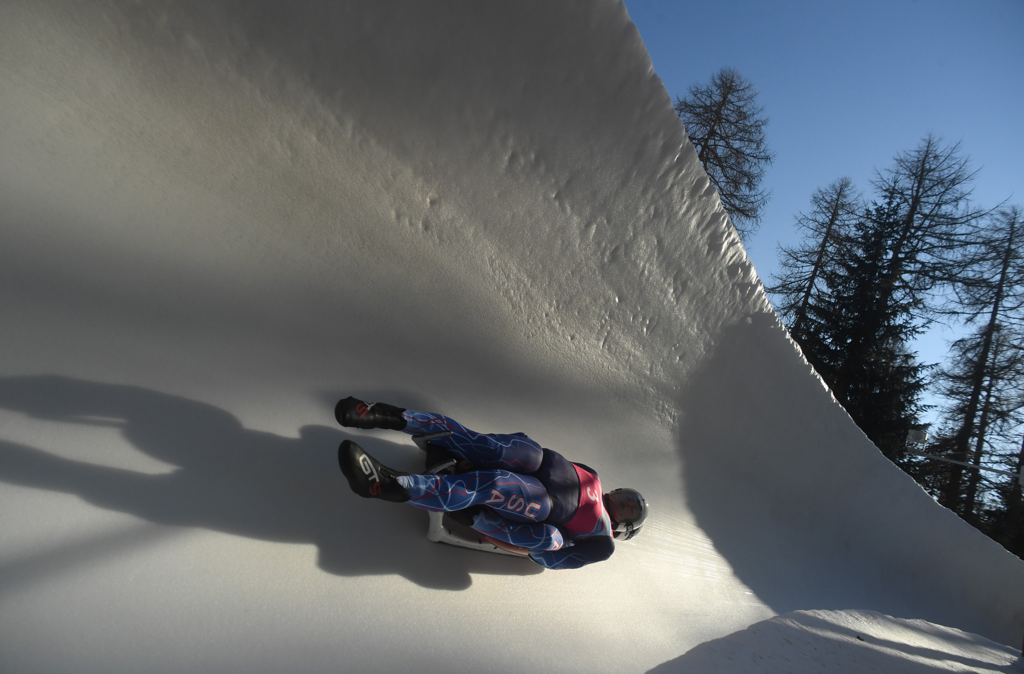 Luge: An American luger slides down an iced track at the competition, Winter sports discipline. 2050x1350 HD Wallpaper.
