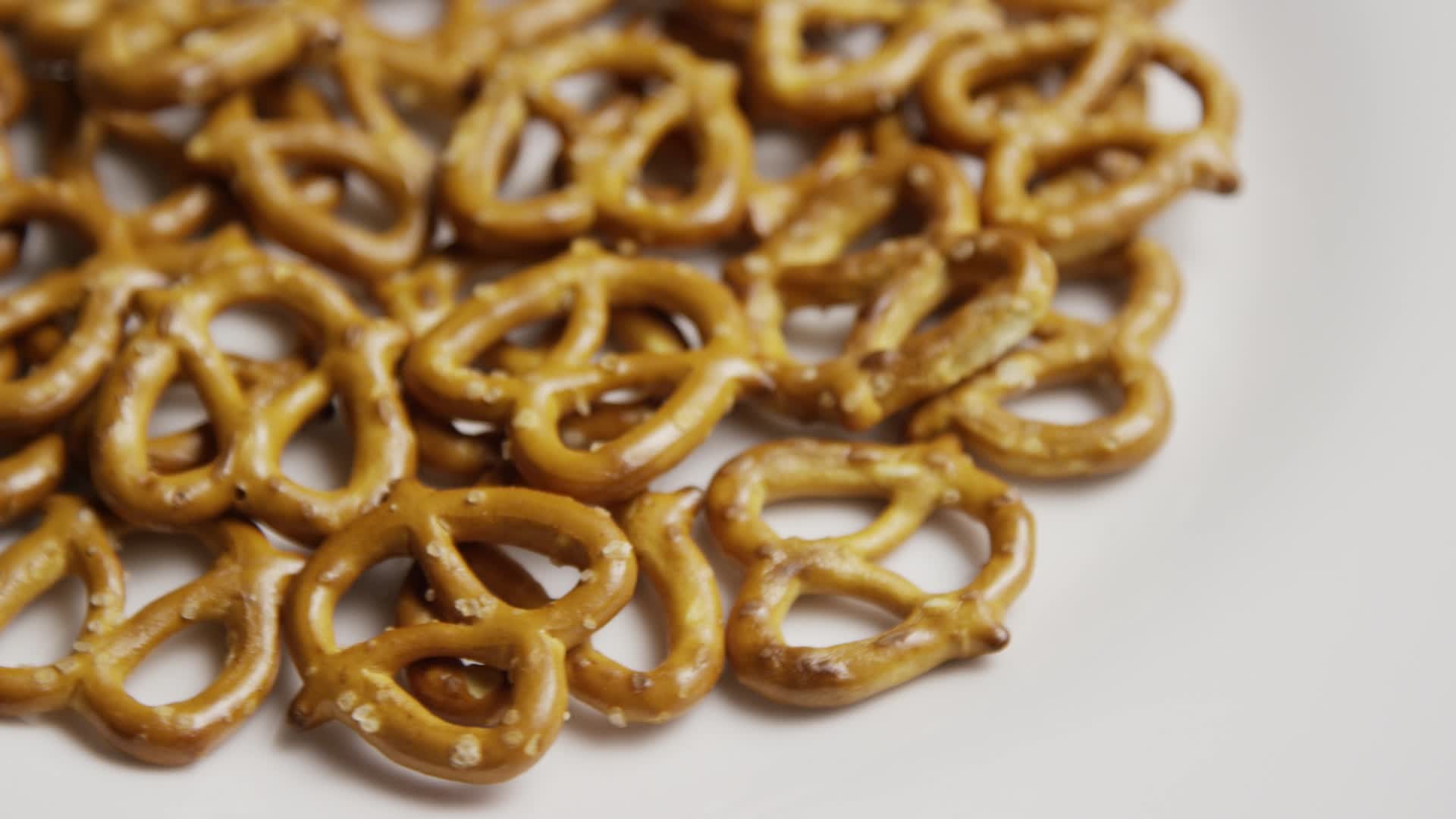 Rotating pretzels, White plate, Delicious appetizer, Stock video footage, 1920x1080 Full HD Desktop
