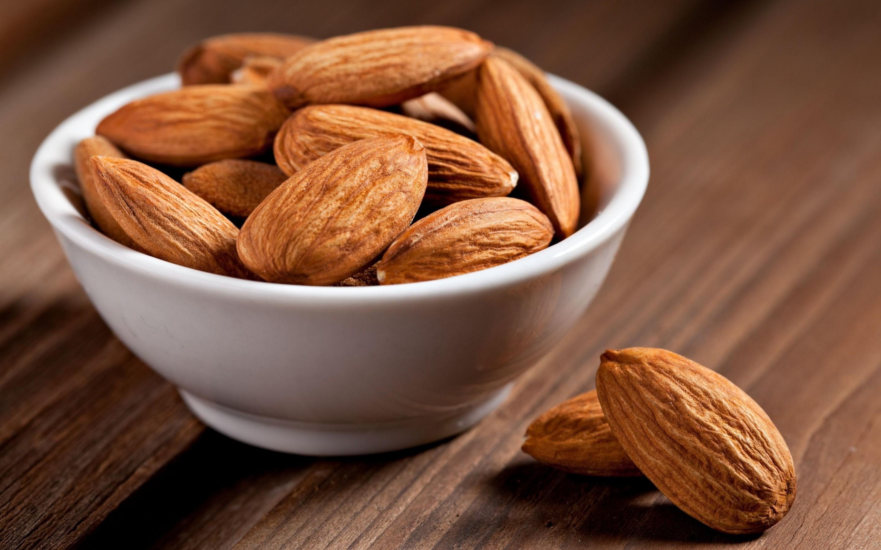 Almonds: A popular nut, Eaten raw or roasted, Incorporated into a variety of foods. 2880x1800 HD Background.