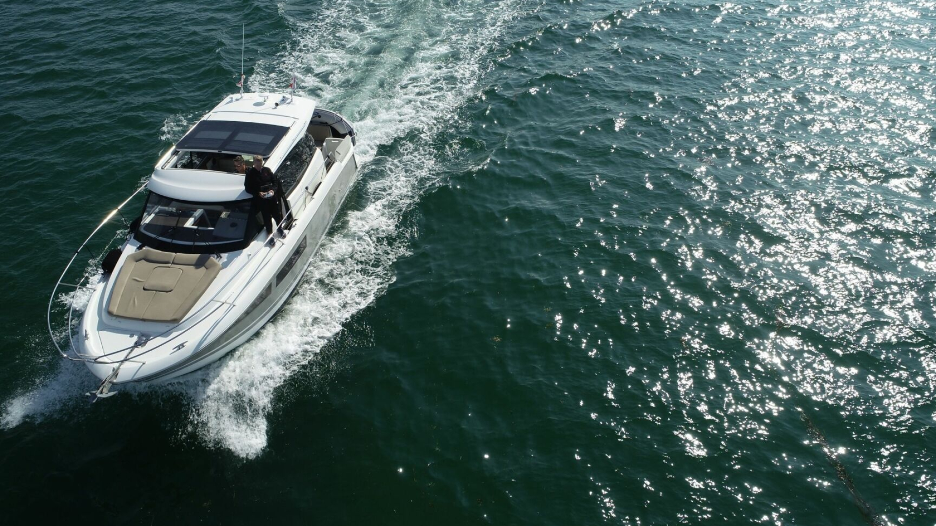 Motorboat: Charter Jeanneau Nc9, Powered water vehicle. 1920x1080 Full HD Wallpaper.
