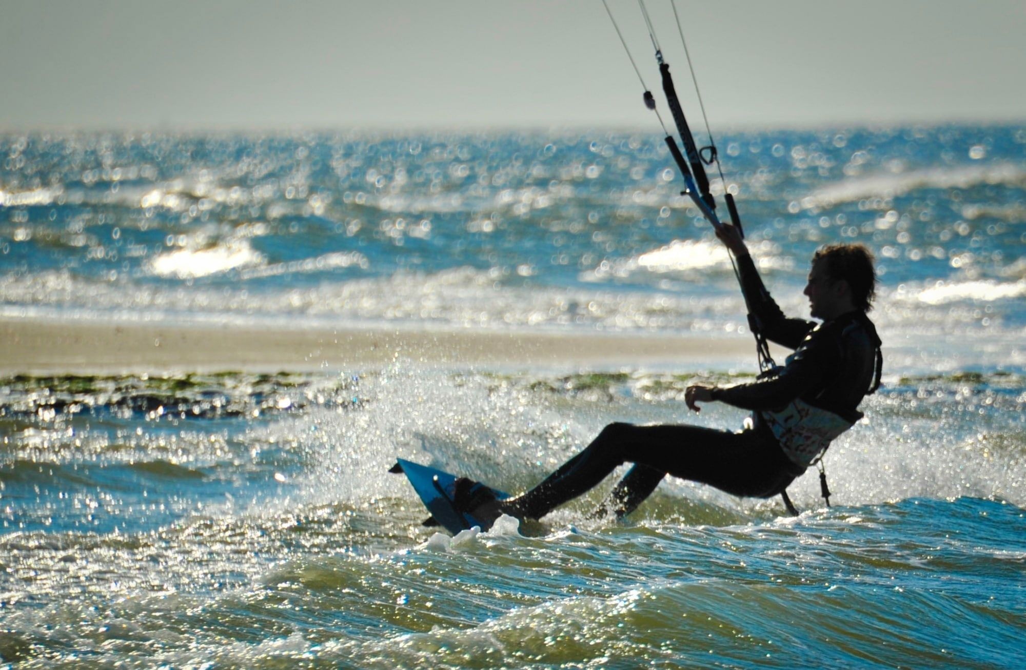 Kiteboarding: Kiting and sailing skill, Kite steering in waves, Black wakeboard. 2000x1310 HD Wallpaper.