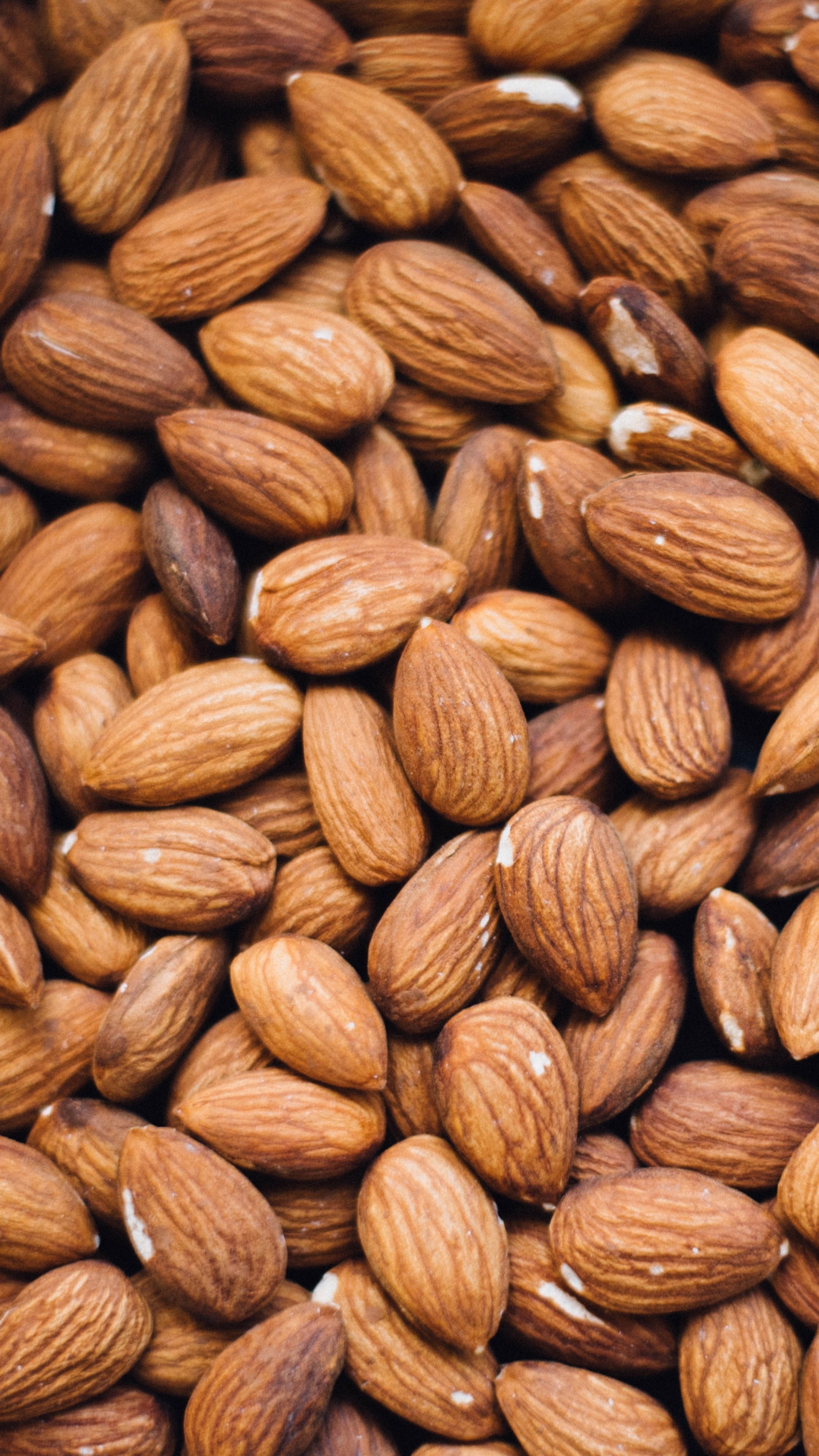 Nuts: Almonds, High in antioxidants, vitamin E, protein, and fiber. 2160x3840 4K Background.