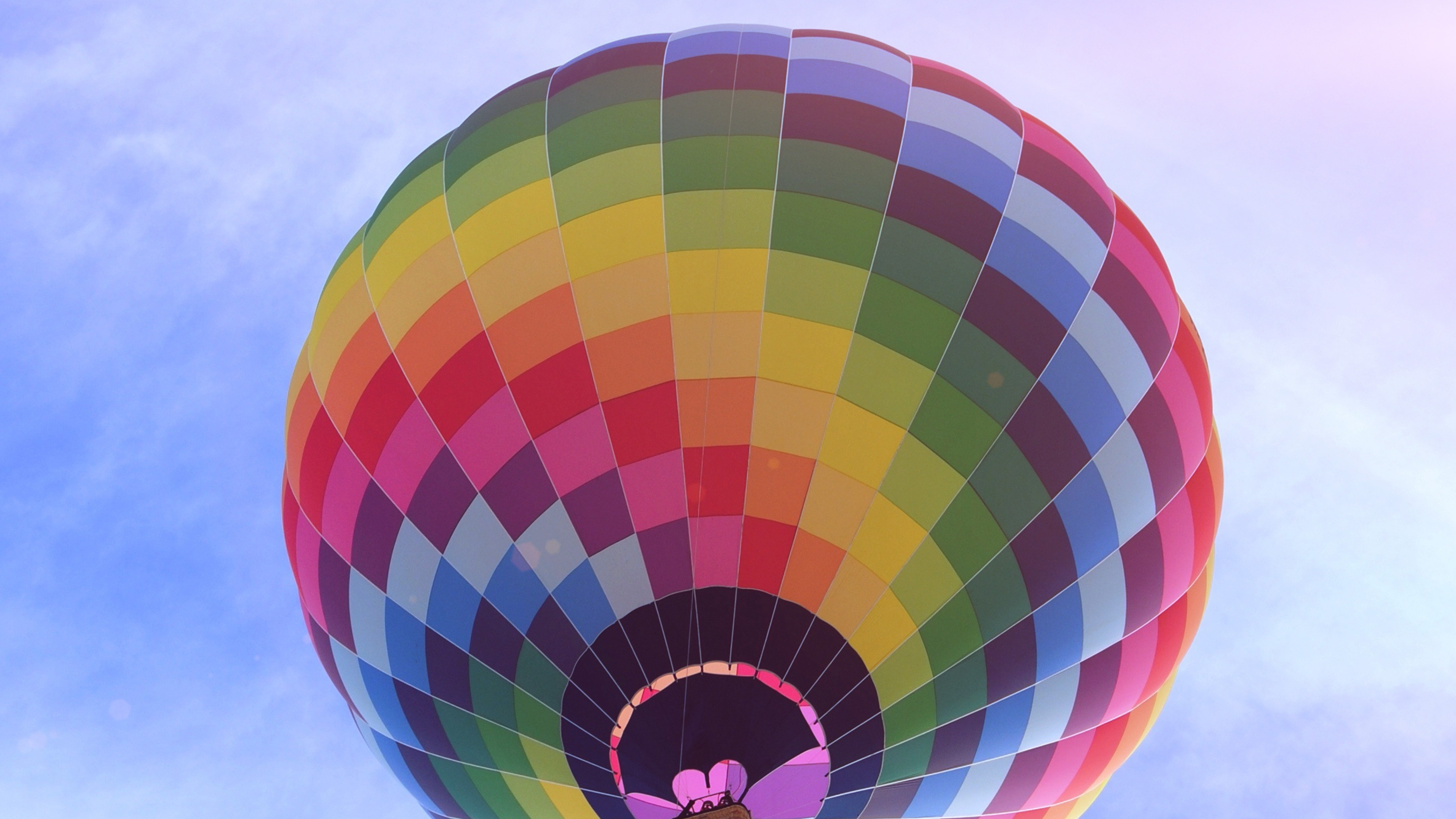 Air Sports: Colored hot-air balloon flight deep into the light blue sky. 3840x2160 4K Wallpaper.