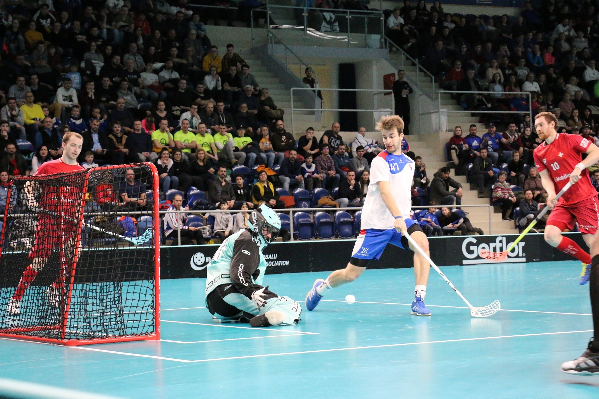 Floorball: A goalkeeper tries to catch the ball during the WFC 2020 qualifications game. 2050x1370 HD Wallpaper.