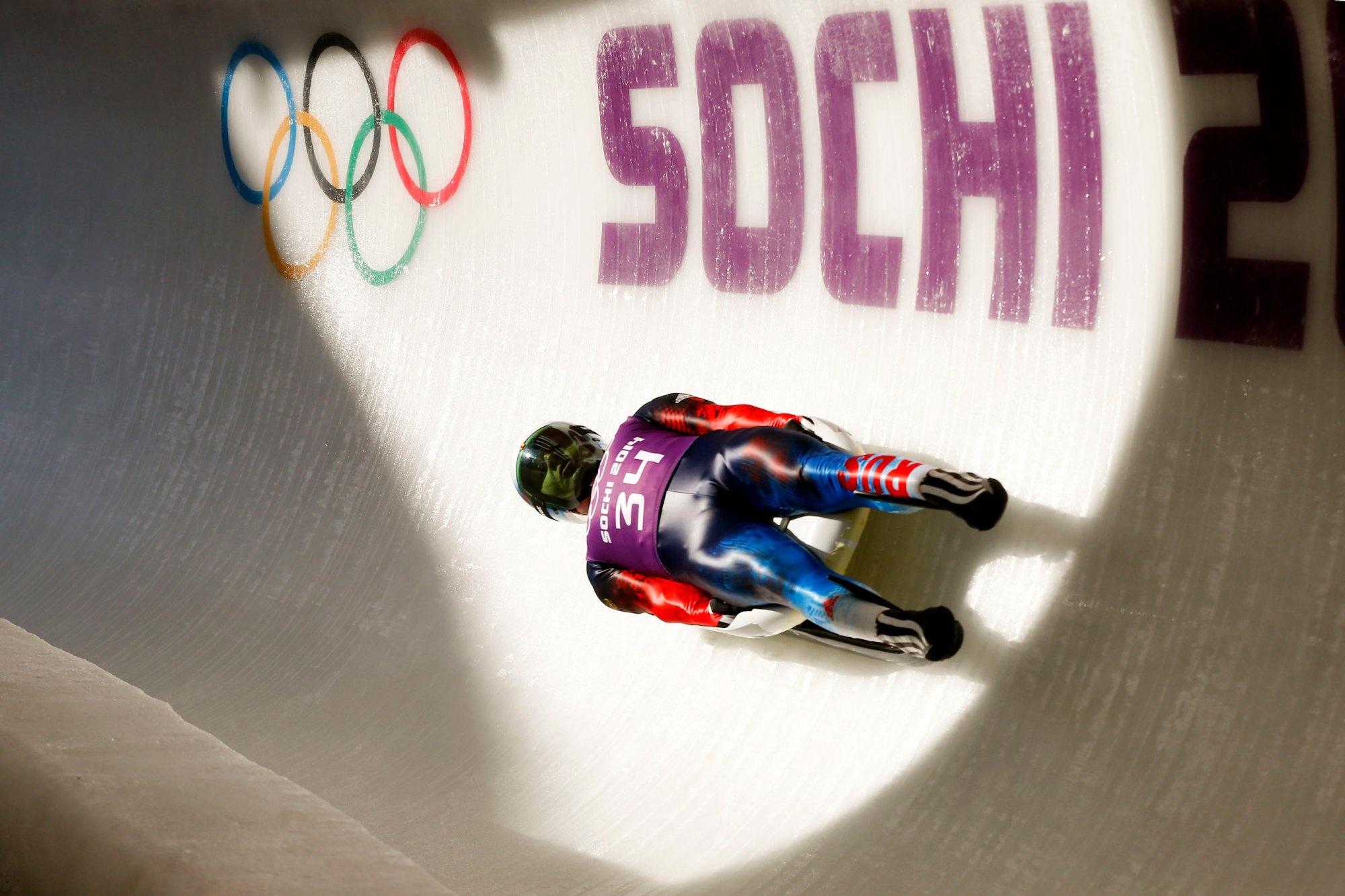 Luge: A Russian luger slides down the track at the 2014 Sochi Winter Olympic Games. 2000x1340 HD Wallpaper.