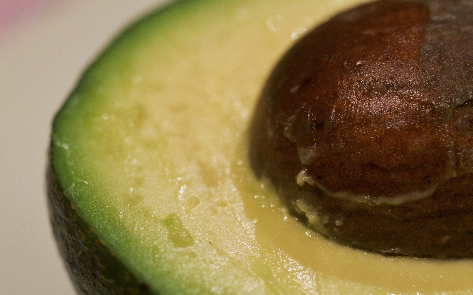 Avocado: A bright green fruit with a large pit and dark leathery skin. 1920x1200 HD Background.