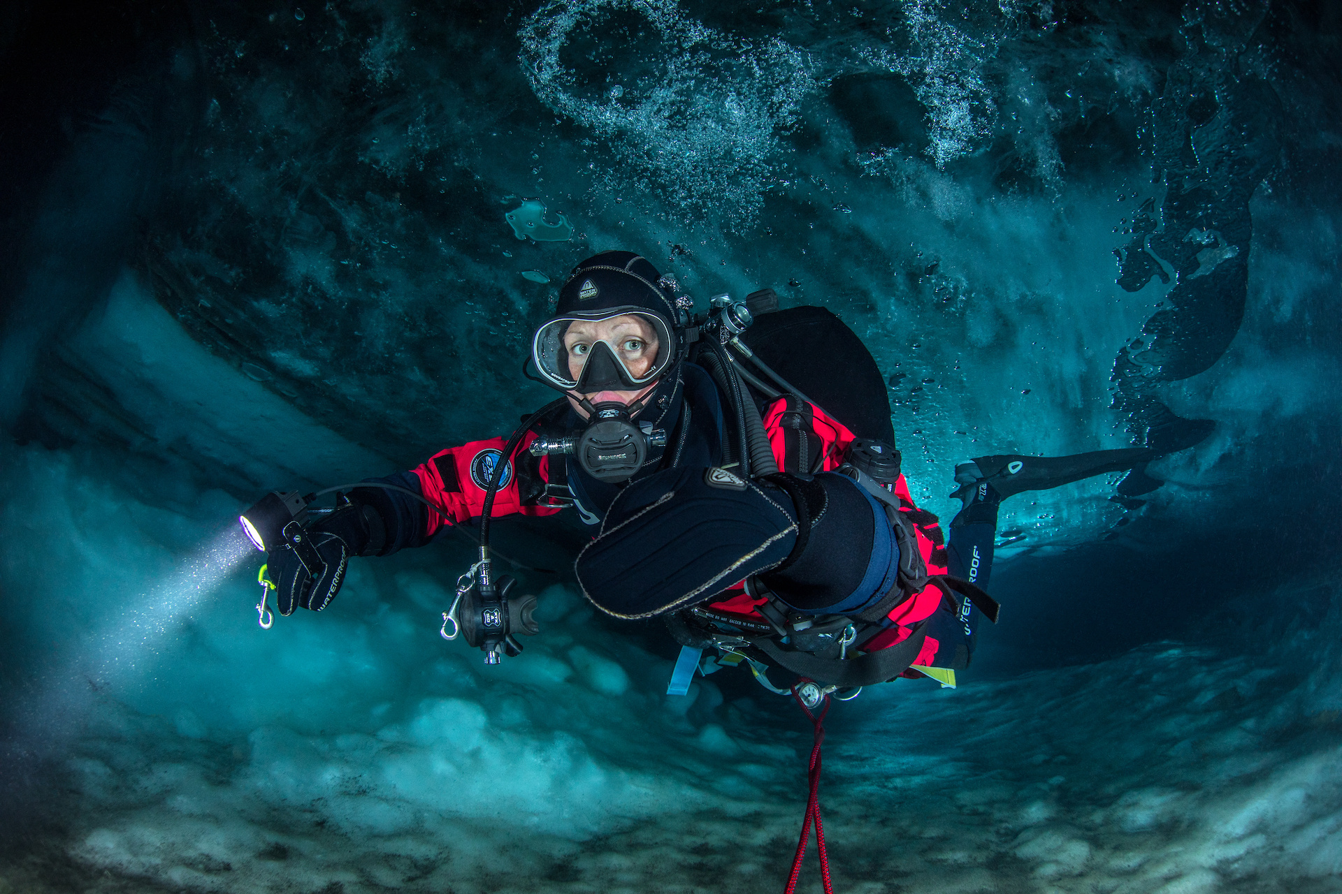 Scuba Diving: Swimming underneath glaciers in flooded ice caves, An extremely dangerous water sport. 1920x1280 HD Background.