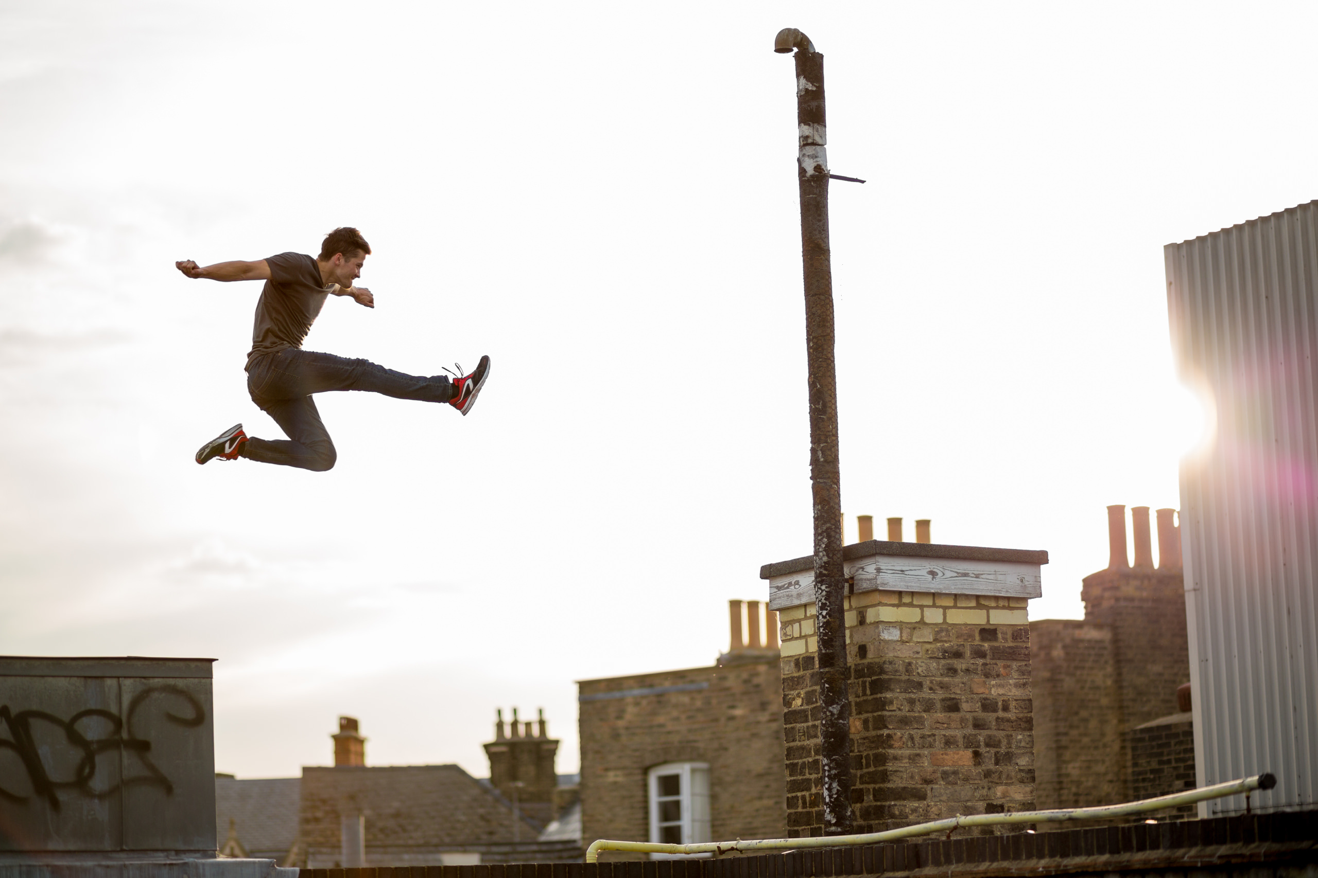 Freerunning: Parkour, Acrobatic and athletic sport with aesthetic elements, Jumping over the buildings. 2560x1710 HD Background.