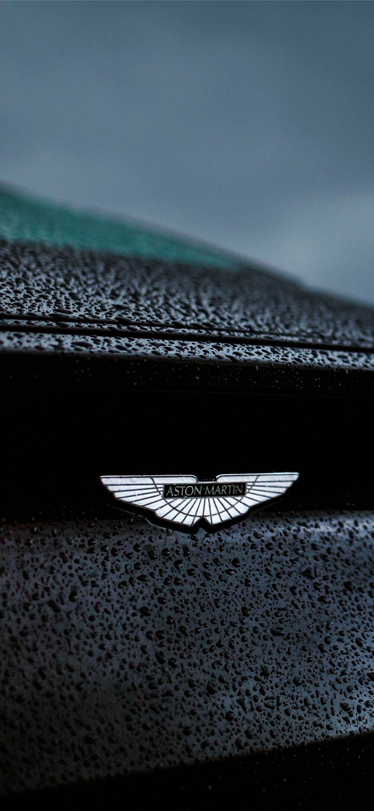 Aston Martin: A British luxury automobile manufacturer, AM logo. 1290x2780 HD Background.