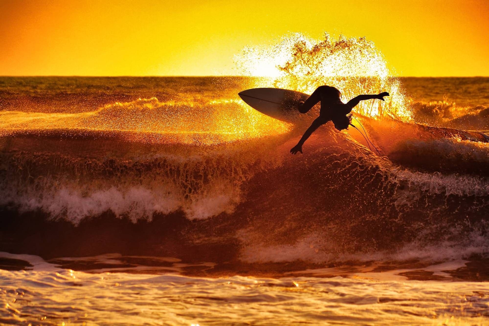 Sunset beach surfing, Golden hour magic, Ocean tranquility, Surfer's paradise, 2000x1340 HD Desktop