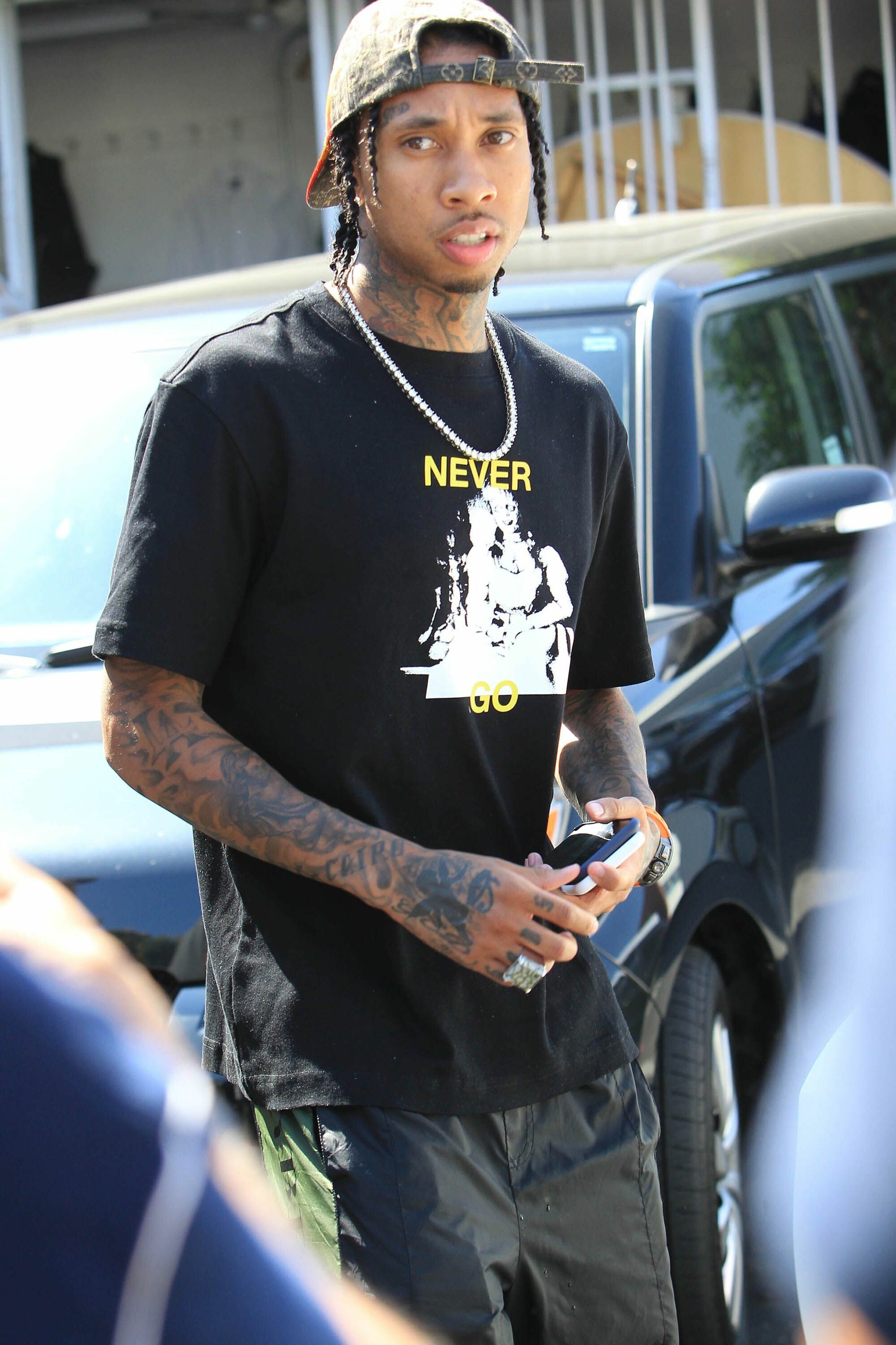 Tyga: Signed a recording contract with Young Money Entertainment, Cash Money Records and Republic Records in 2008. 2000x3000 HD Background.