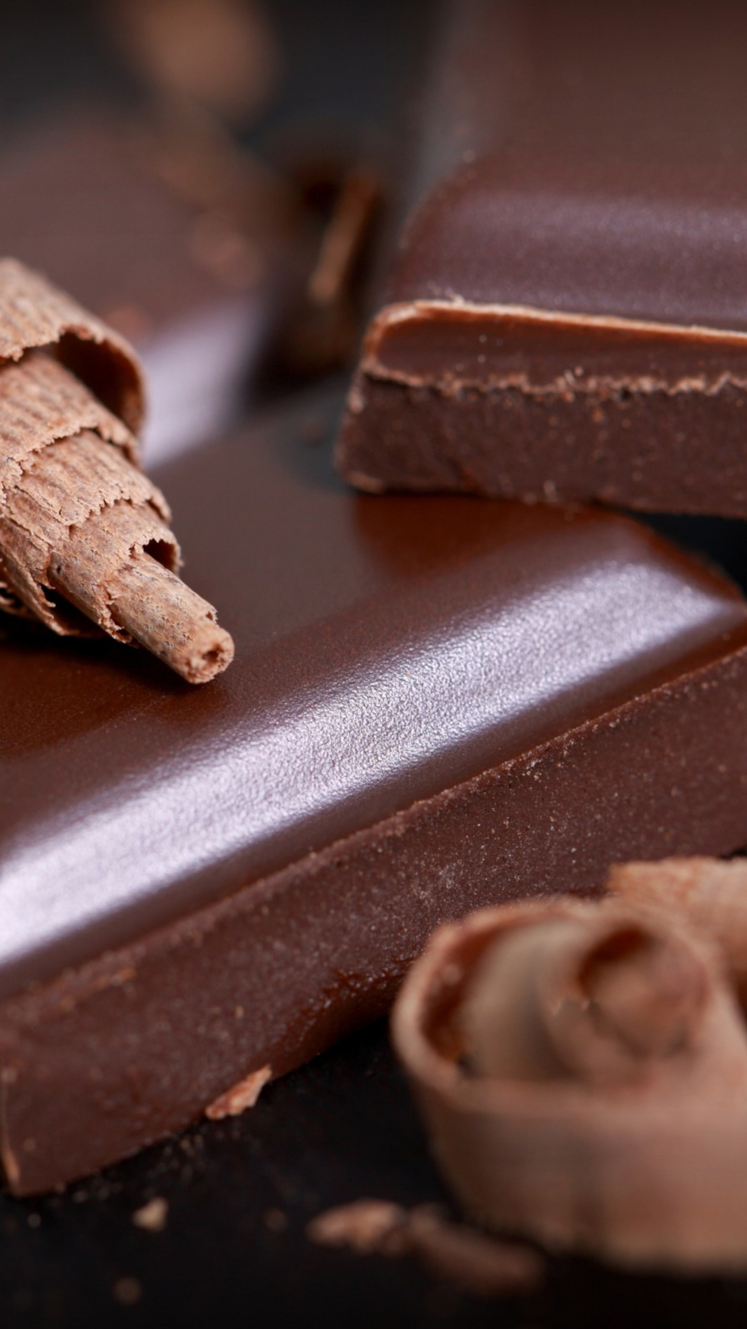 Chocolate: A rich source of fiber, loaded with iron, magnesium, zinc, copper. 1080x1920 Full HD Background.