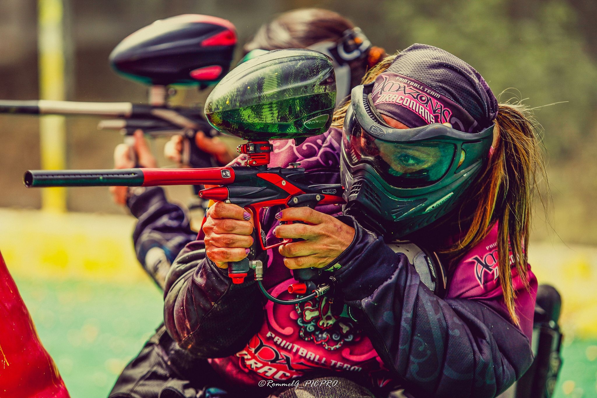 Paintball: Recreational outdoor activity and competitive combat sport played by both men and women. 2050x1370 HD Background.