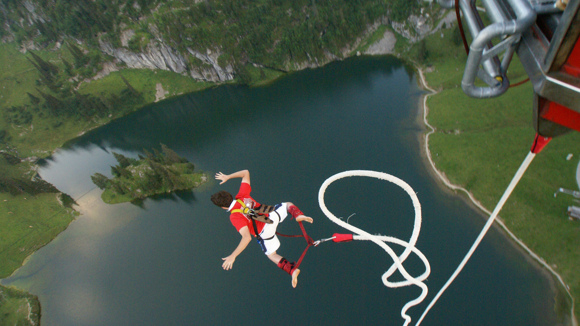 Bungee Jumping: An activity that involves a person falling from a great height while connected to a large elastic cord. 1920x1080 Full HD Wallpaper.