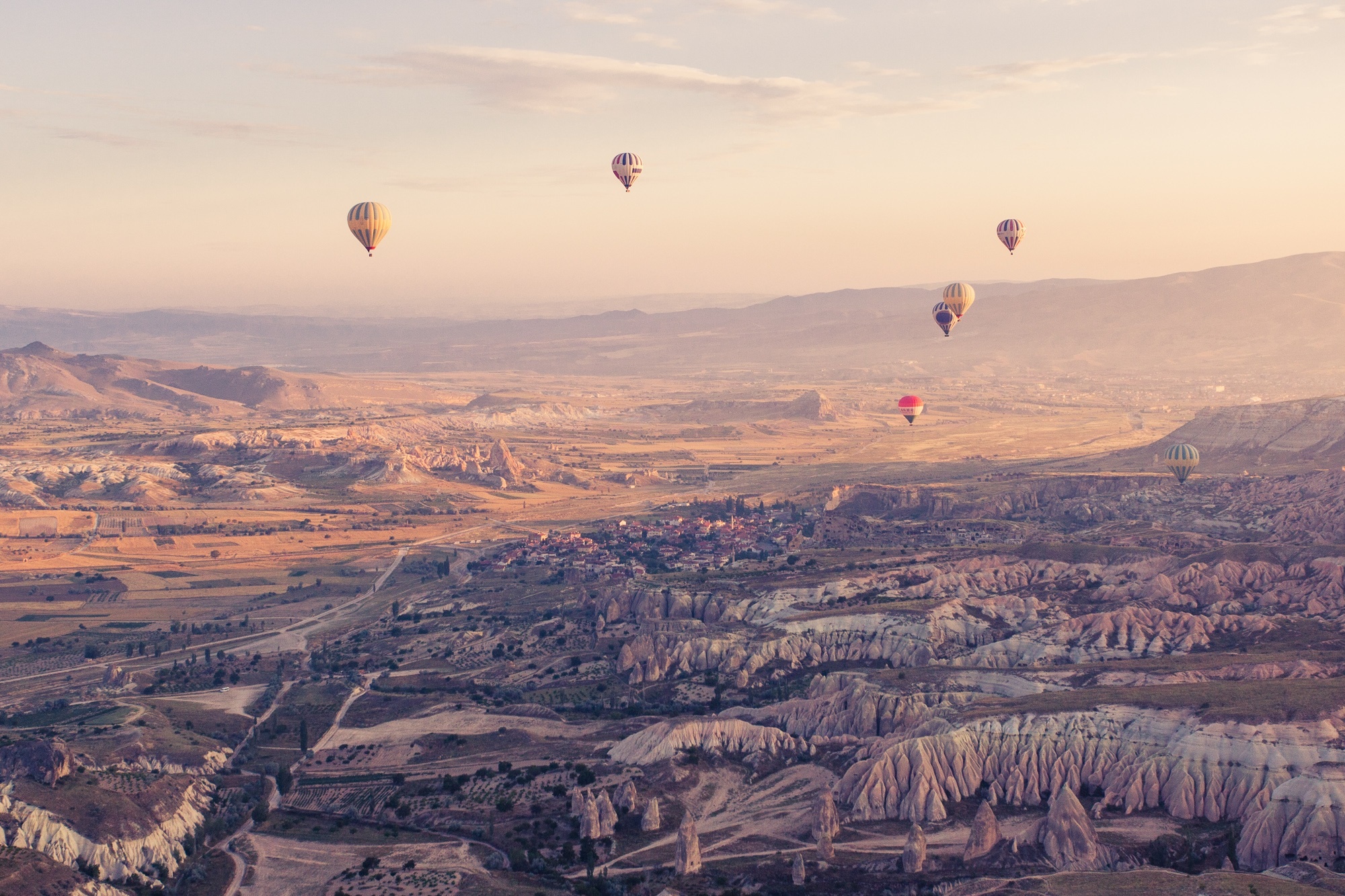 Air Sports: Extreme ballooning over the rock hills, Sunset time in mountains, Balloon festival. 2000x1340 HD Background.