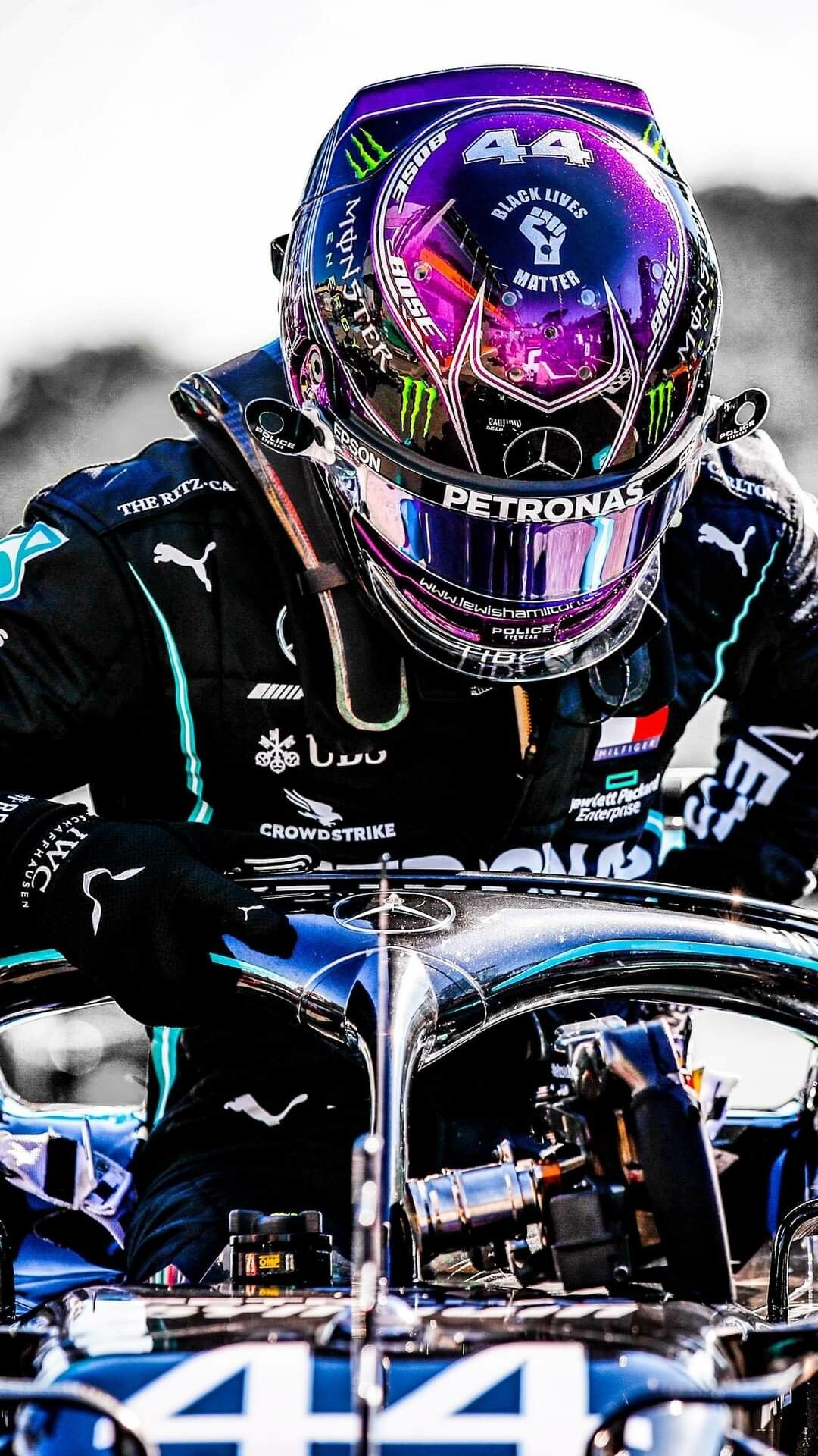 Lewis Hamilton: A British Formula One racing driver, holding the record for the number of pole start positions (103). 1080x1920 Full HD Background.
